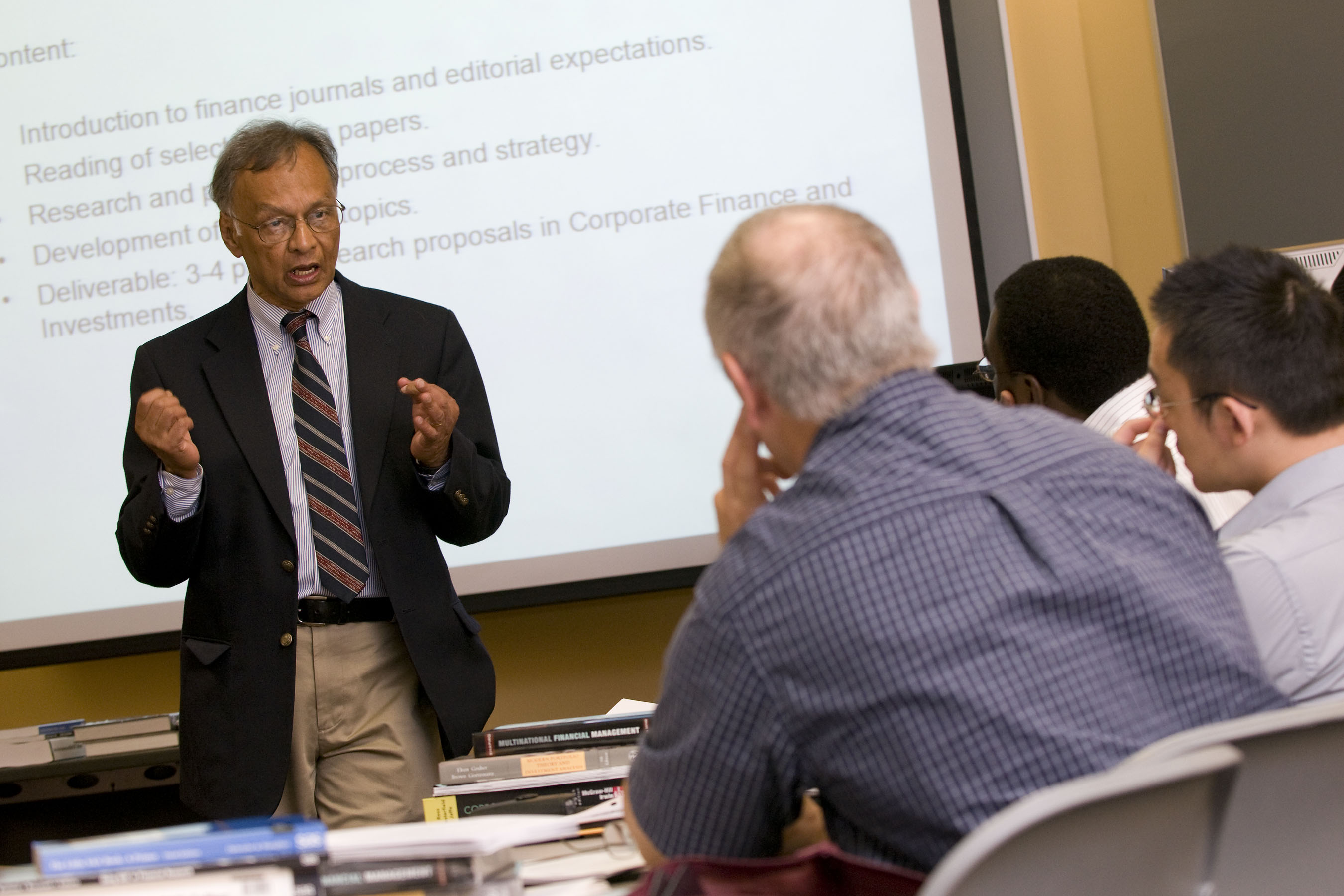 Finance professor Dilip Shome leads a bridge program class in finance.