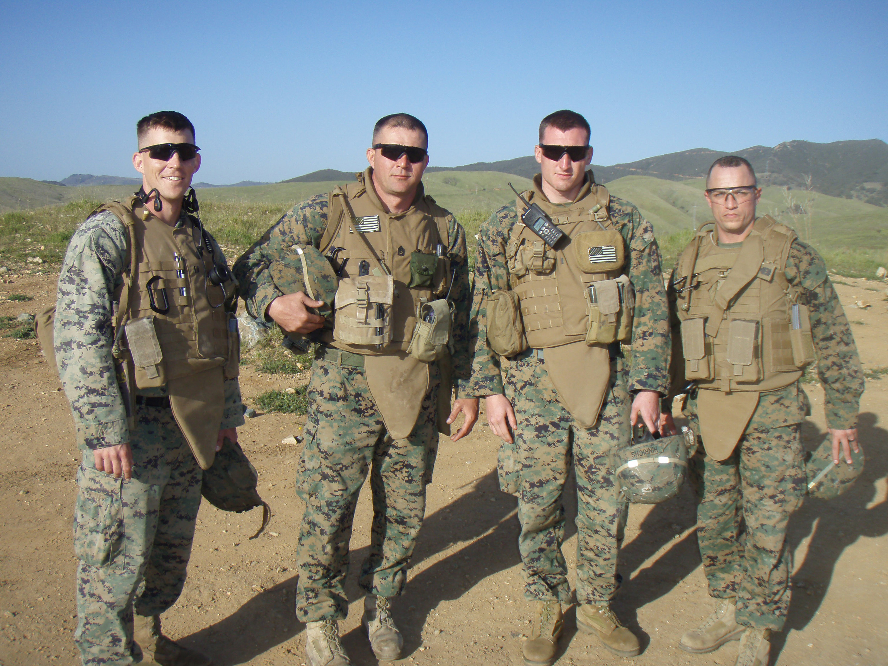 On the far left Capt. George Flynn, U.S. Marine Corps, Virginia Tech Corps of Cadets Class of 2001 standing with fellow Marines in Afghanistan