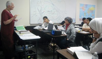 Teacher Lois Ingles instructs a class of Saudi students.