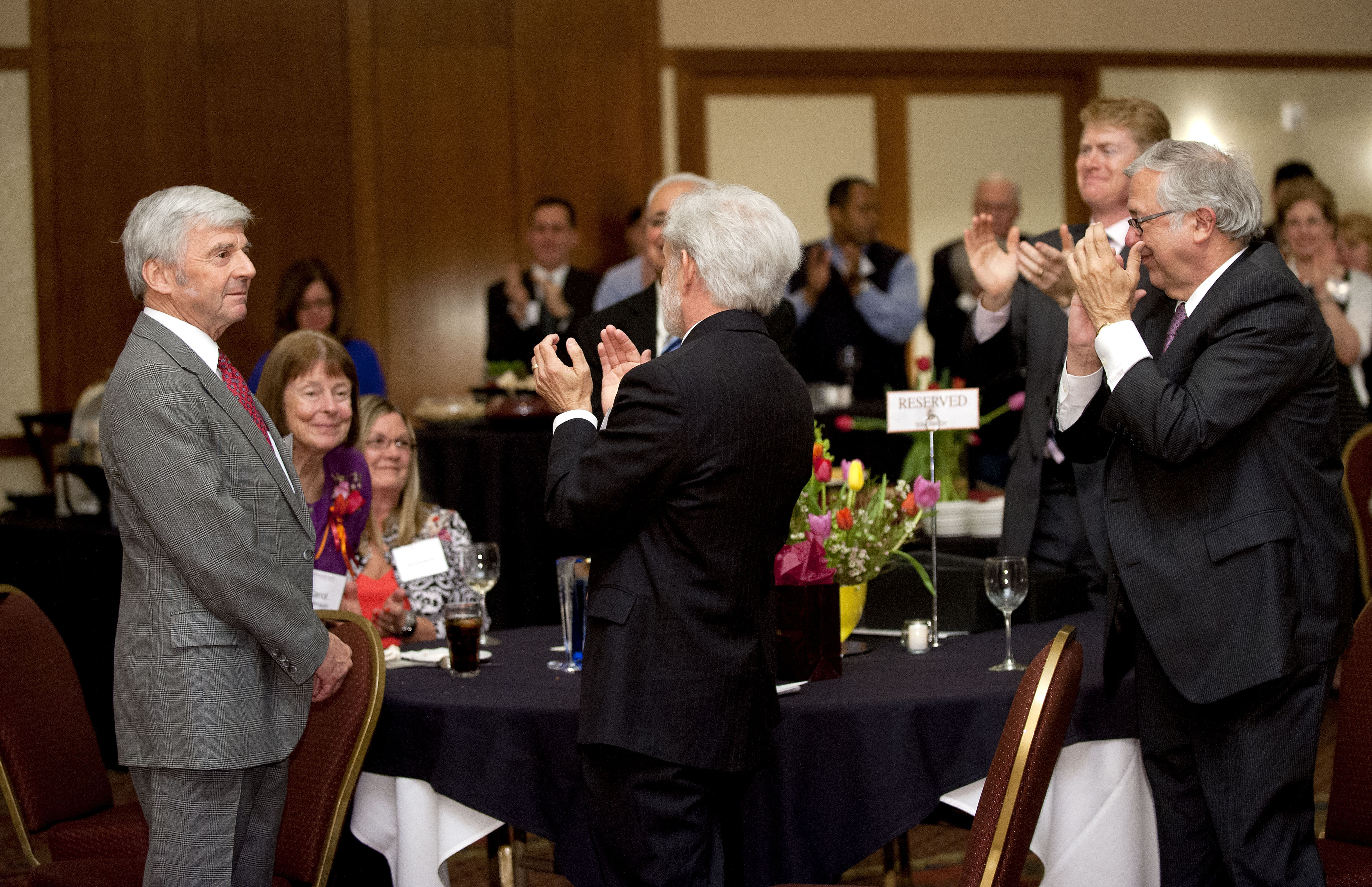 Pamplin College of Business dean Richard E. Sorensen receives a standing ovation at his retirement reception from Pamplin faculty, staff, alumni, university officials, and other guests. 