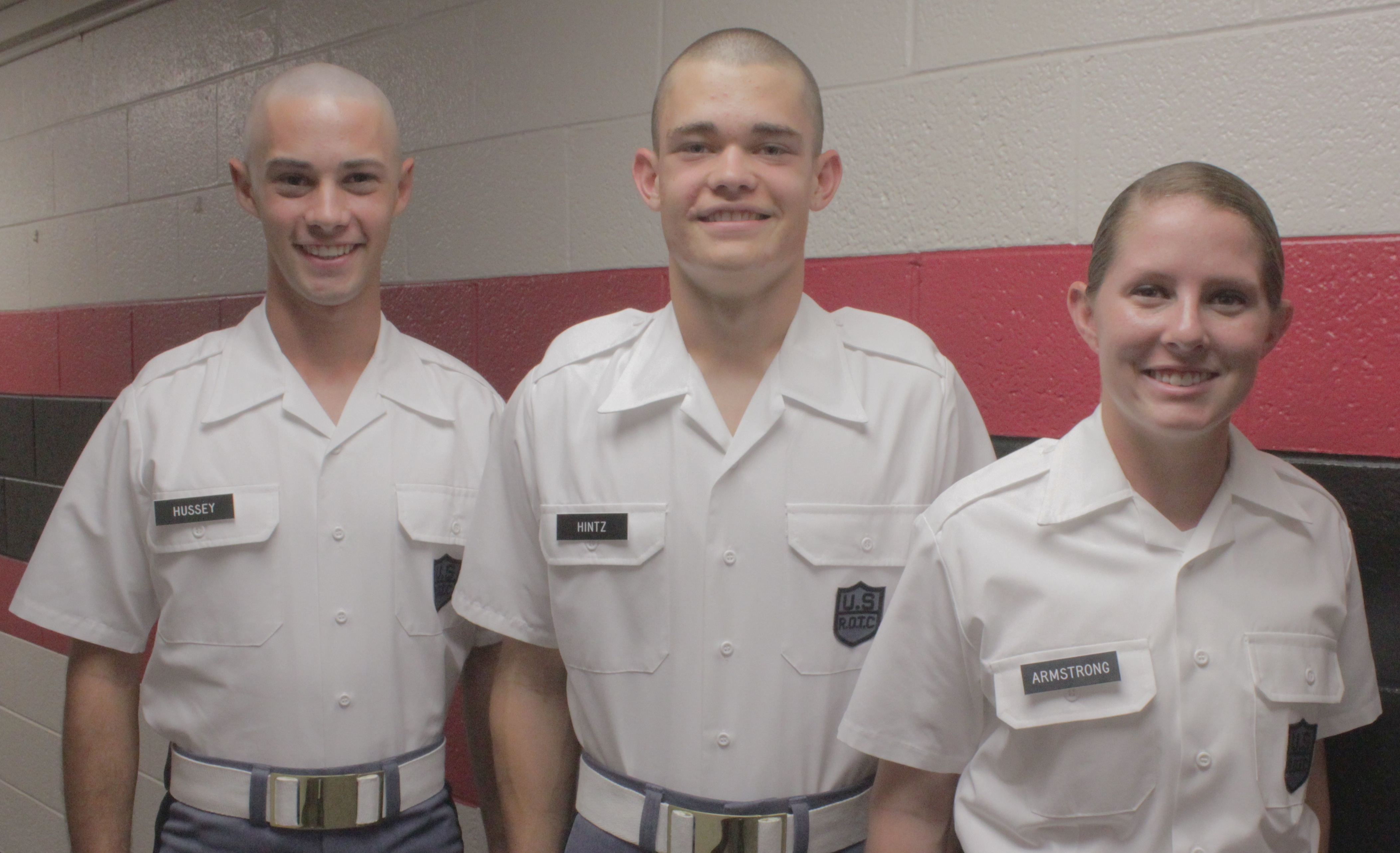 From left to right are Cadets Lawrence Hussey, Christopher Hintz, and Lisa Armstrong standing in Brodie Hall.