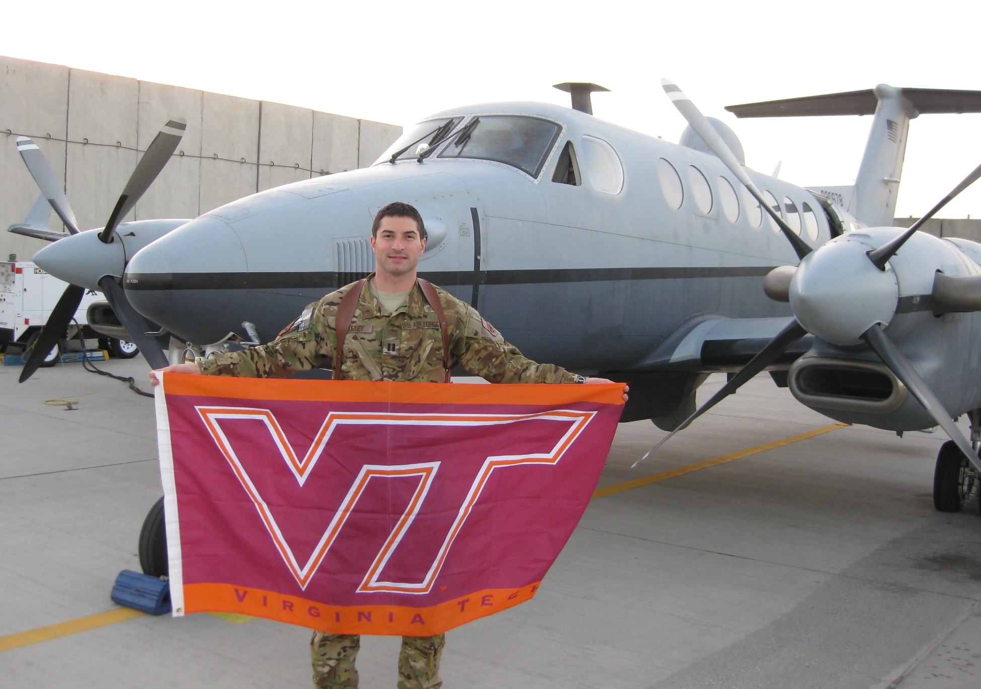 Capt. Andrew Smithey, U.S. Air Force, Virginia Tech Corps of Cadets Class of 2007 in front of his aircraft