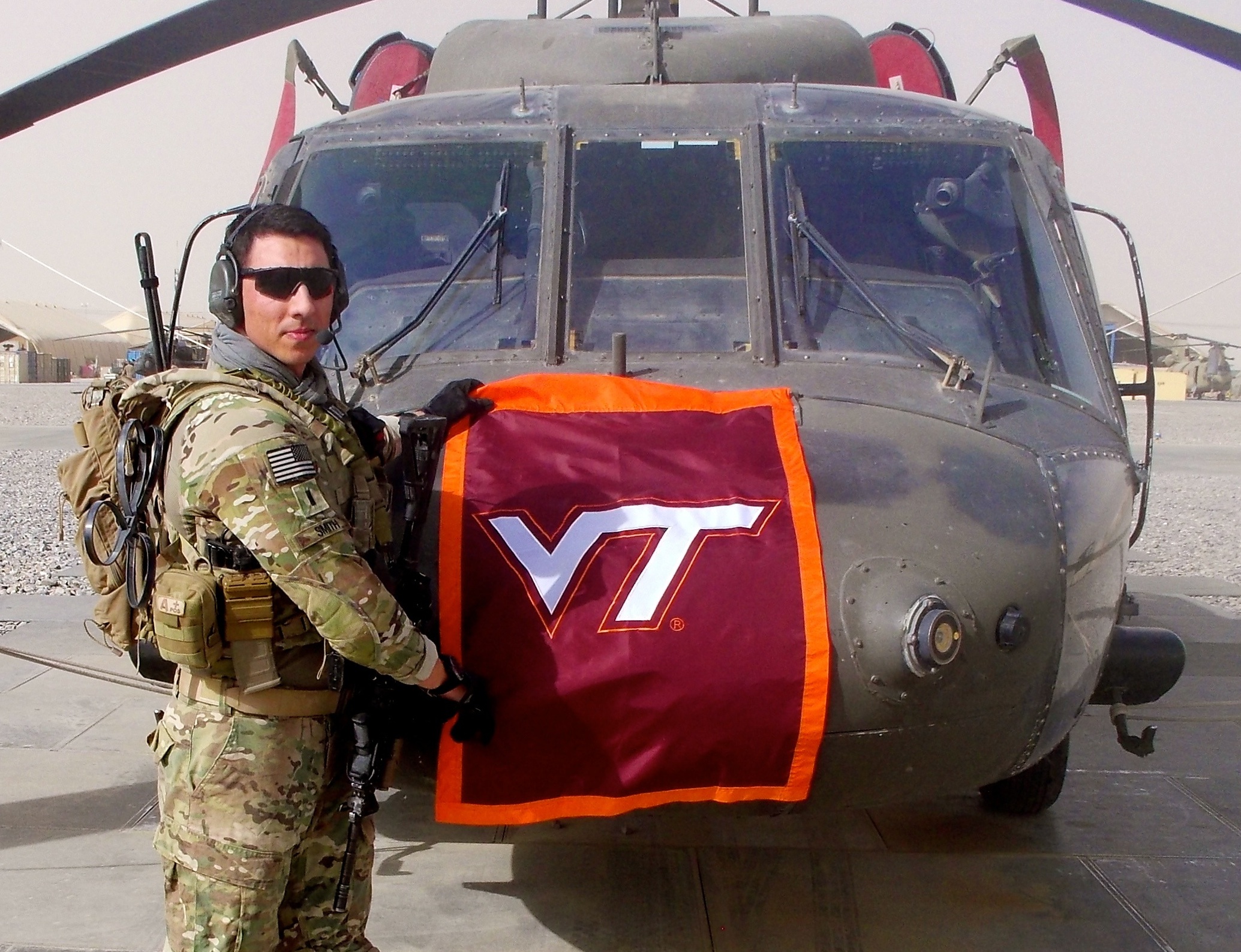1st Lt. Matthew Smith, U.S. Army, Virginia Tech Corps of Cadets Class of 2011 in front of his helicopter.