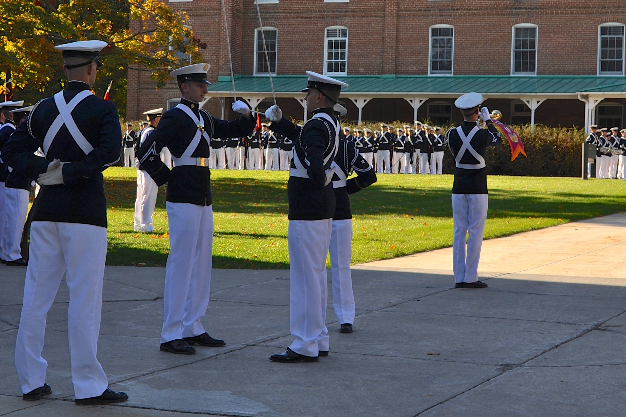 The Virginia Tech Corps of Cadets honor the colors during a formal retreat ceremony on the Upper Quad.