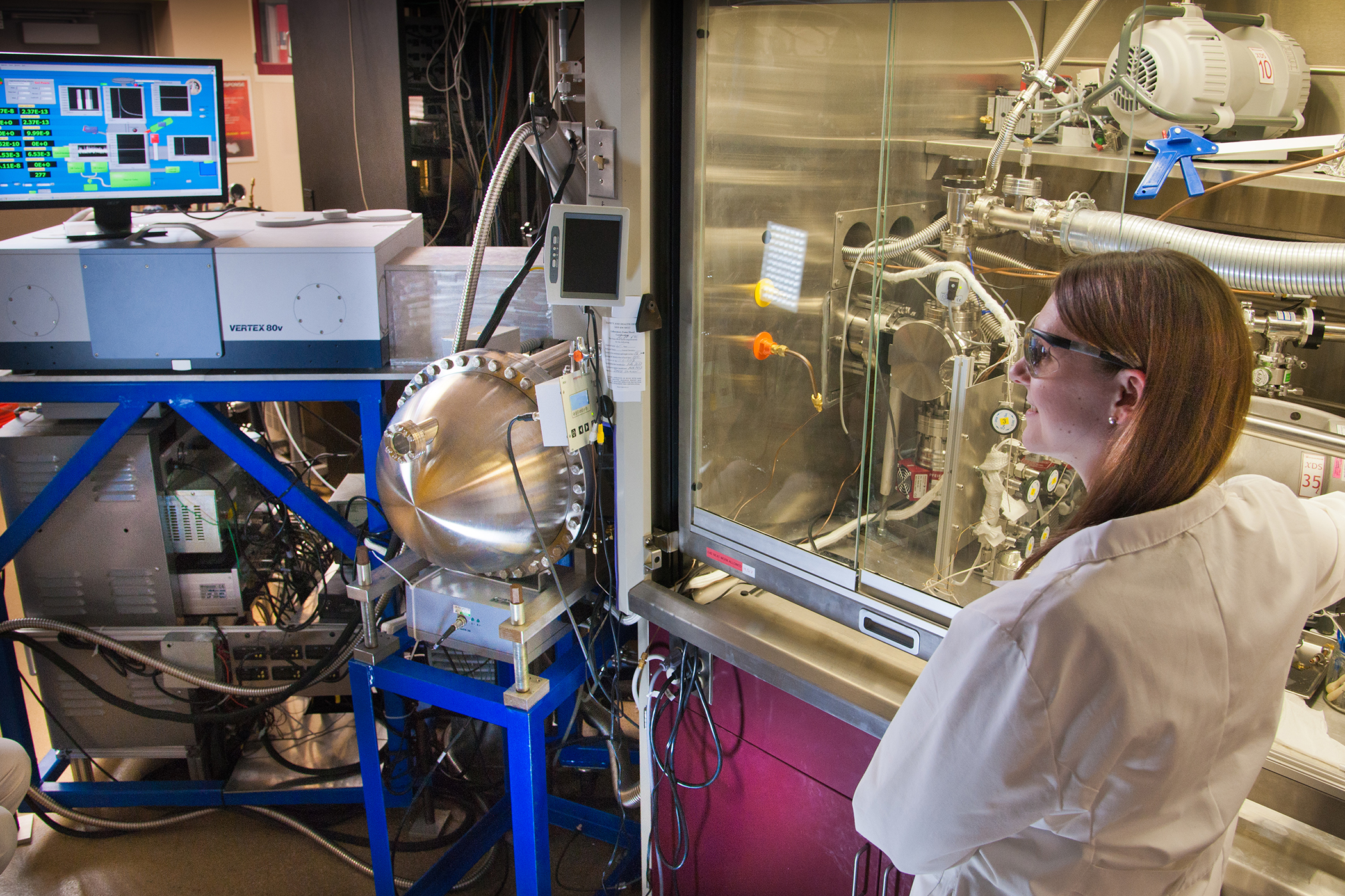 Erin Durke, a chemist with Excet Inc., works with the chemical analyzer built at Virginia Tech.