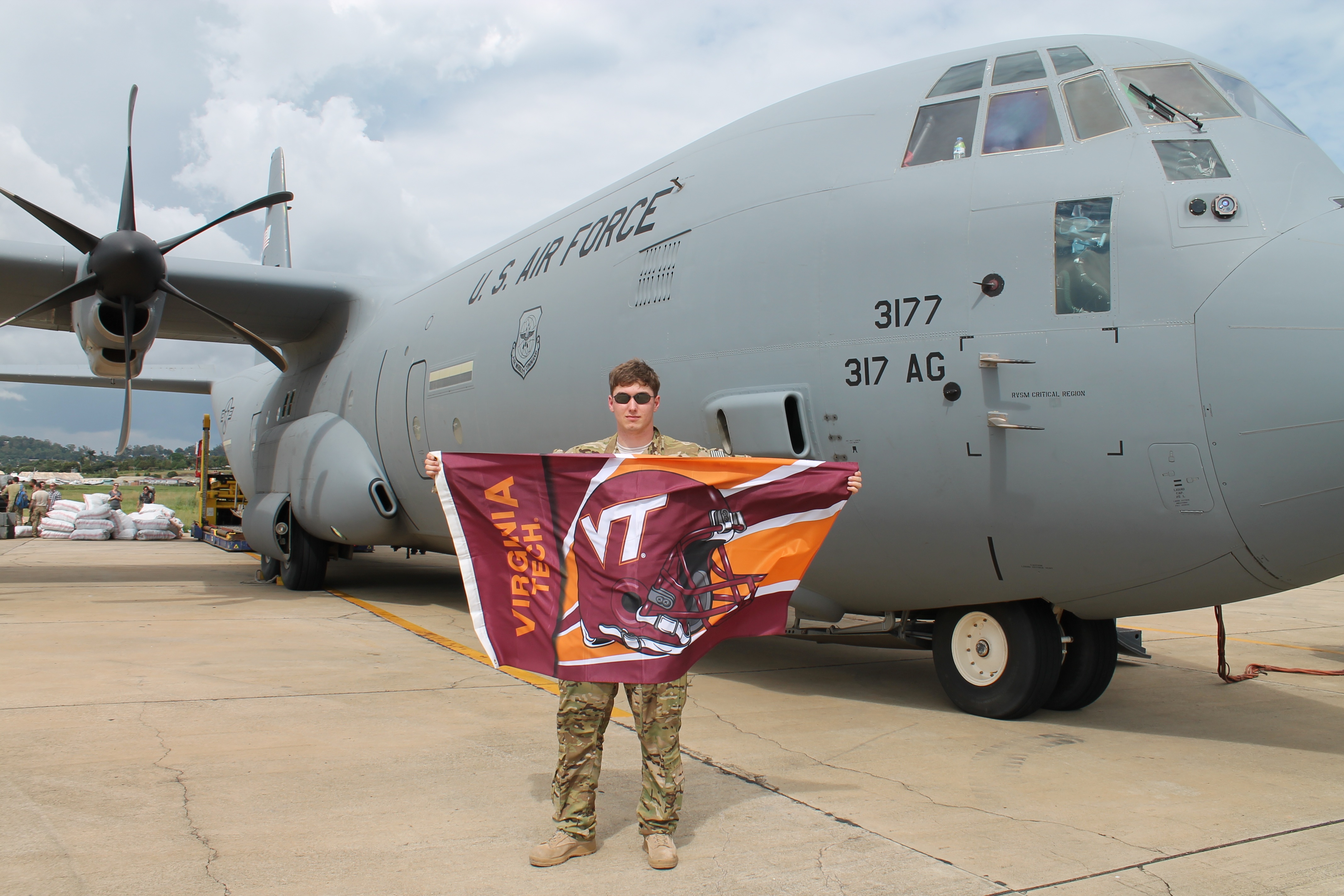 1st Lt. David Jacobs, U.S. Air Force, Virginia Tech Corps of Cadets Class of 2011 standing in front of a C-130J aircraft.
