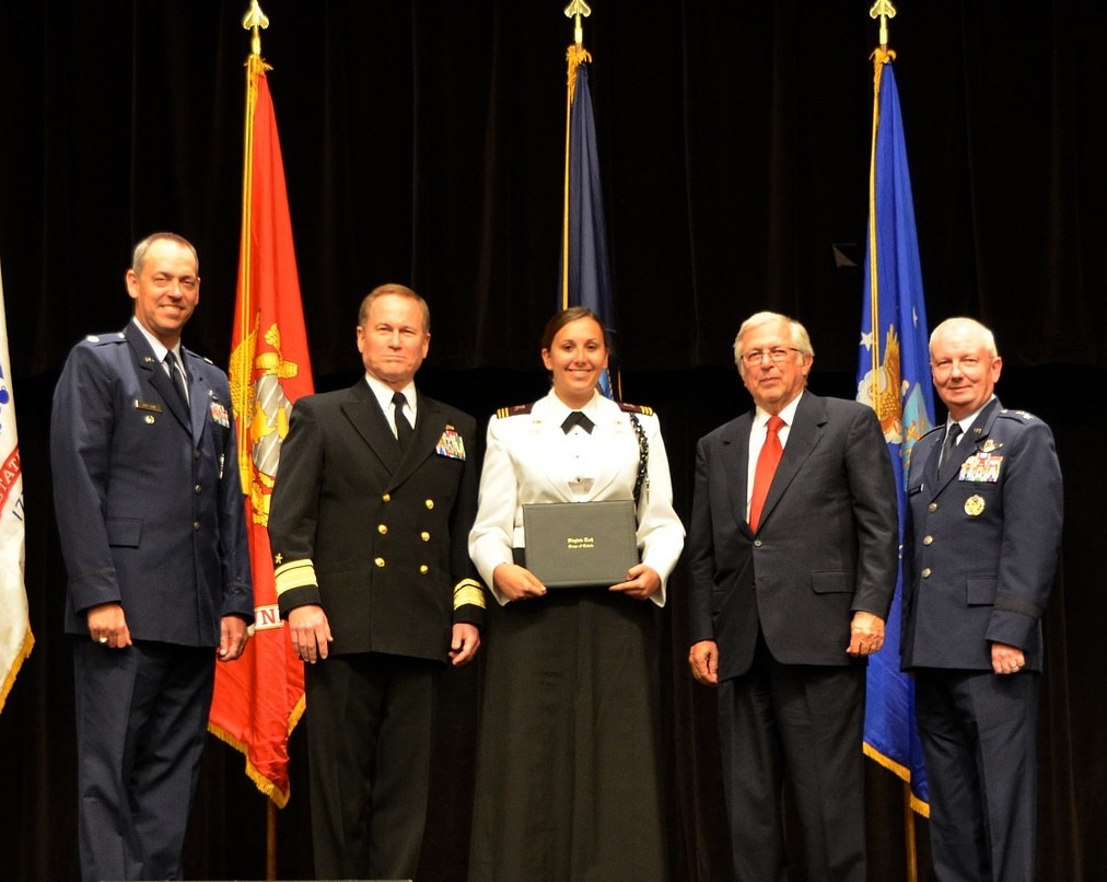 Sarah Farace receives her graduation certificate from the Virginia Tech Corps of Cadets last May on the Burruss Hall auditorium stage.