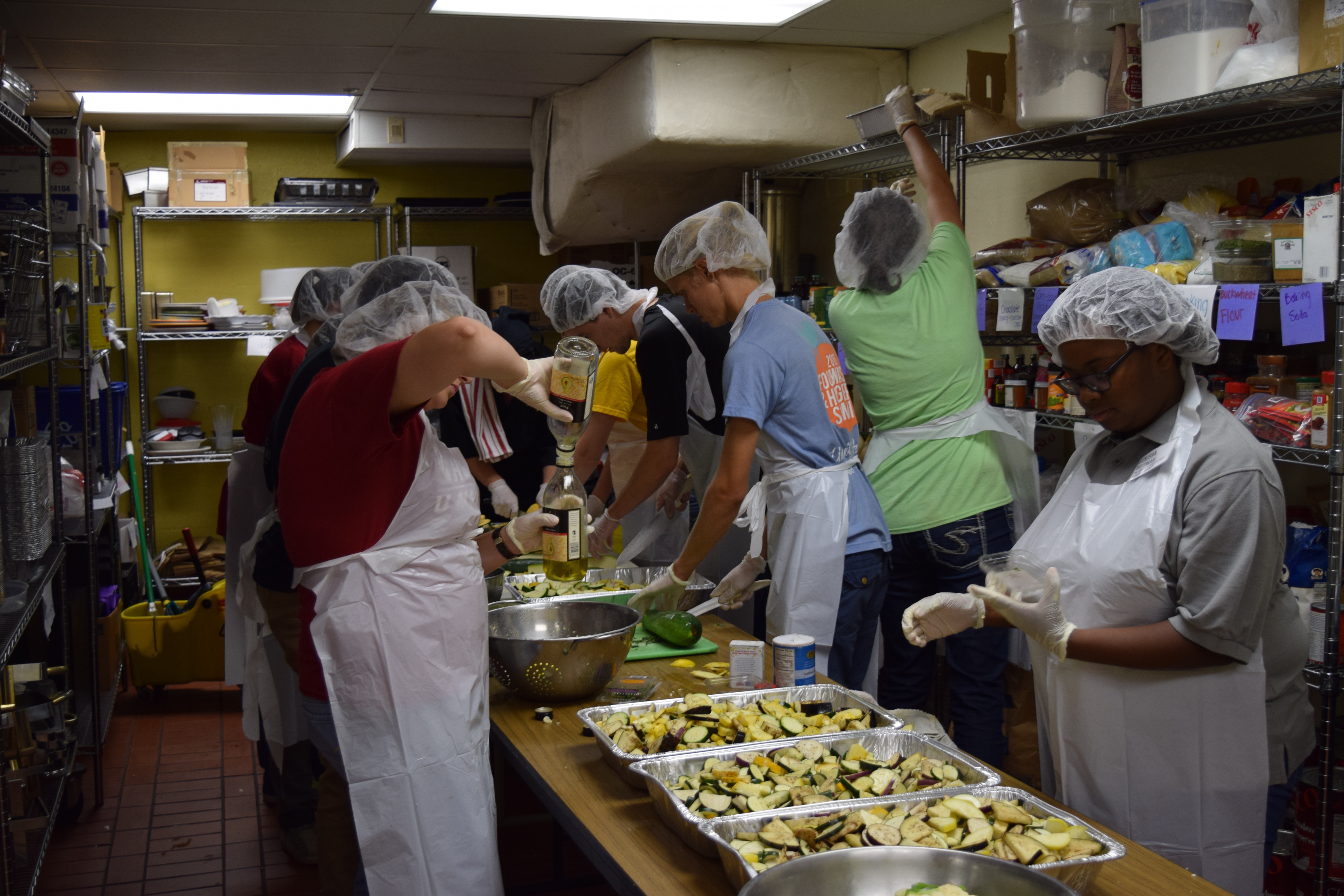 Students work in a Campus Kitchen to make meals for those in need