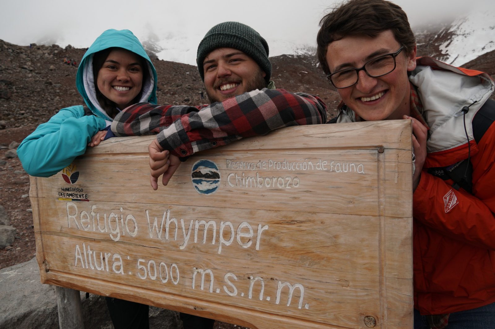 Virginia Tech Agricultural and Applied Economics students smile on Chimborazo volcano.