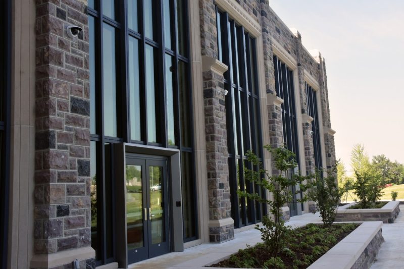 Side view of the Data & Decision Sciences Building, which features alternating Hokie Stone and tall windows.