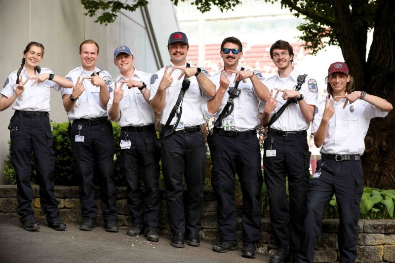 Virginia Tech Rescue Squad members with VT fingers