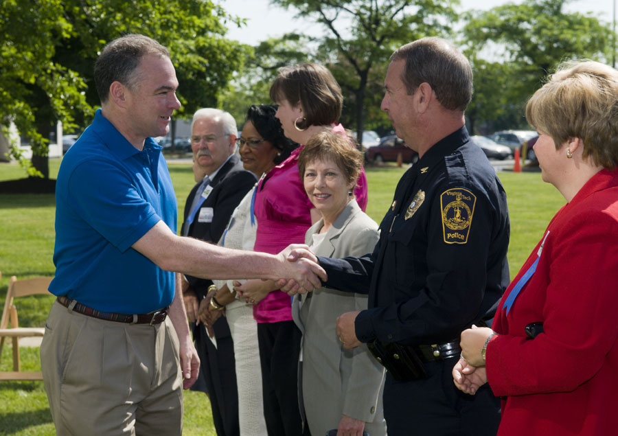 Virginia Tech Police Chief Wendell Flinchum is congratulated by Virginia Gov. Timothy Kaine.