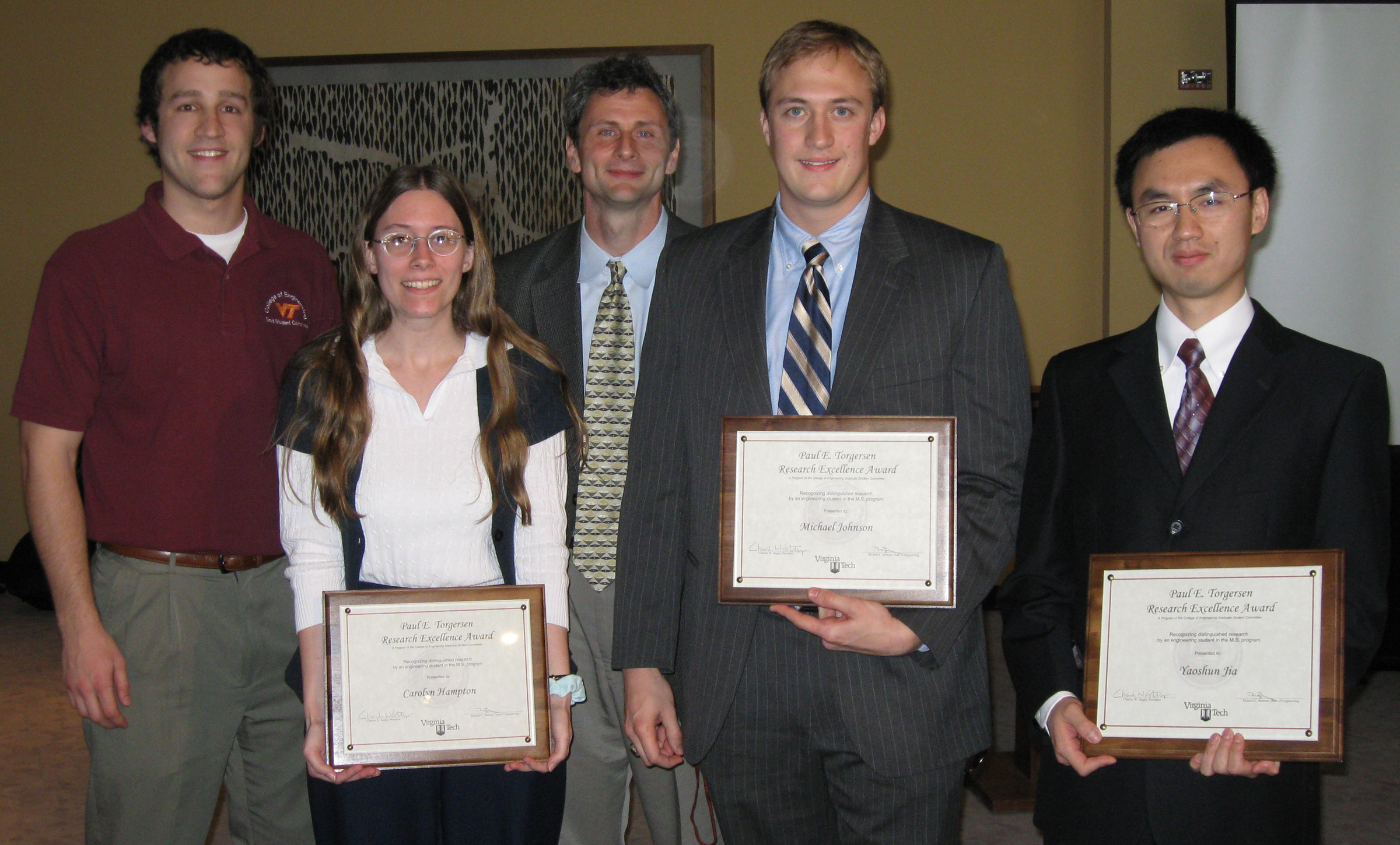 Left to right: Eric Williams, chairman of the Torgersen Awards Committee and a member of the College of Engineering Graduate Student Committee; Carolyn Hampton, a master's student in biomedical engineering; Don Leo, associate dean of research and graduate studies with the College of Engineering; Michael Johnson, a master's student in biological systems engineering; and Yaoshun Jia, a master's student in electrical and computer engineering.