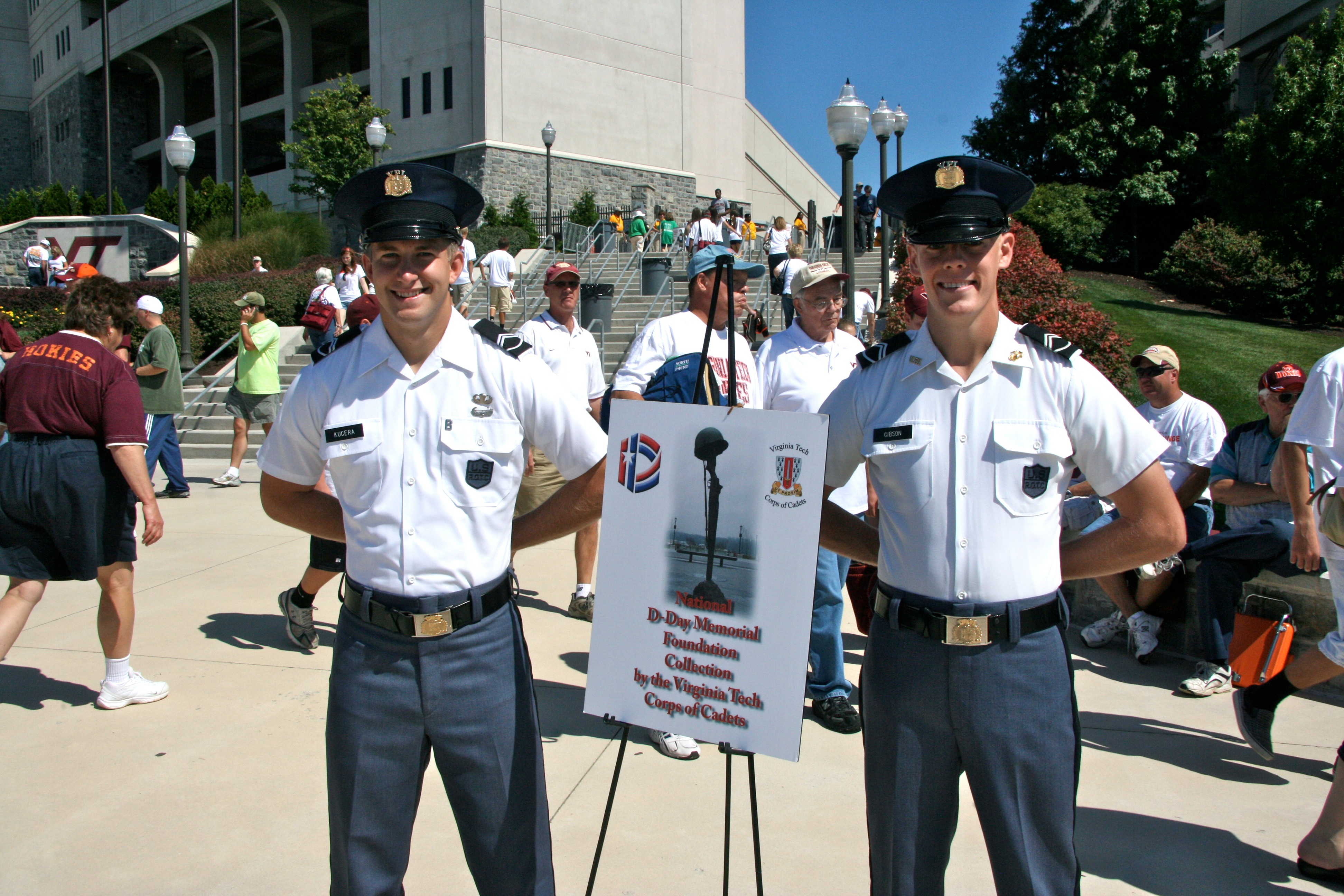 Cadet Adam Kucera of Deptford, N.J. (left), a junior majoring in spanish in the College of Liberal Arts and Human Sciences and Cadet Kelsey Gibson of Orlando, Fla., a senior majoring in political science in the College of Liberal Arts and Human Sciences collect for the National D-Day Memorial at the Virginia Tech versus Marshall game.