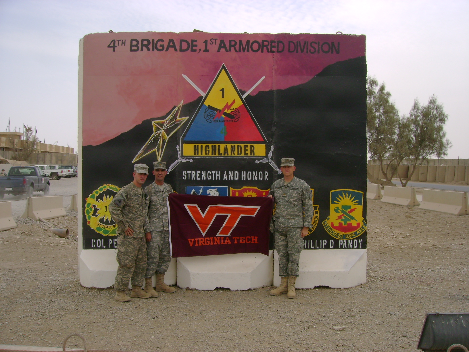 Hogeboom (right) with brothers 1st Lt. Antonio Pazos, member of Virginia Tech Corps of Cadets Class of 2007 who majored in civil engineering in the College of Engineering (left), and Maj. Rafael Pazos, member of Virginia Tech Corps of Cadets Class of 1993 who majored in mechanical engineering also in the College of Engineering (center) pictured outside the 4th Brigade Combat Team, 1st Armored Division Headquarters, COB Adder, Iraq.