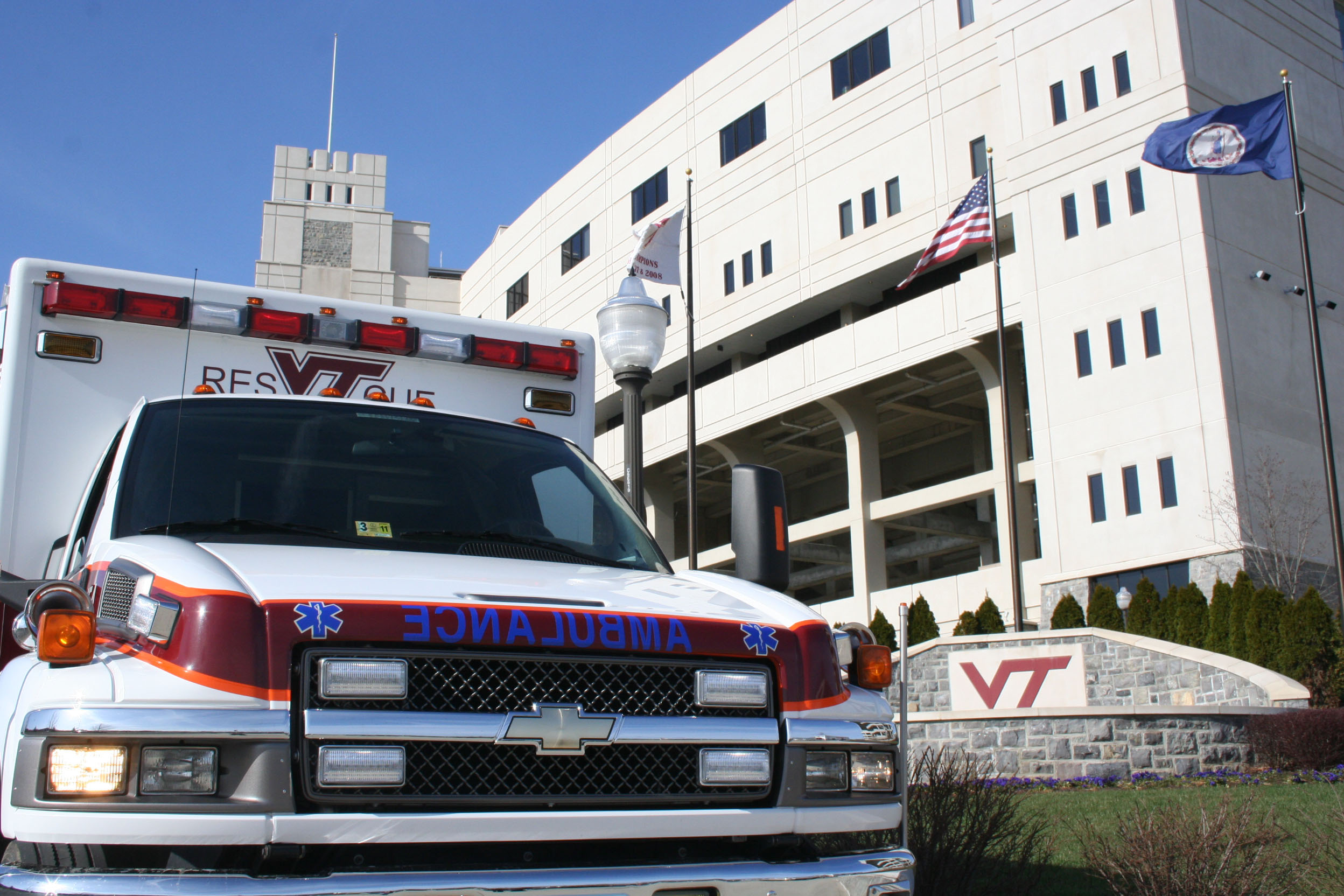 Virginia Tech Rescue Squad ambulance with Lane Stadium in the background