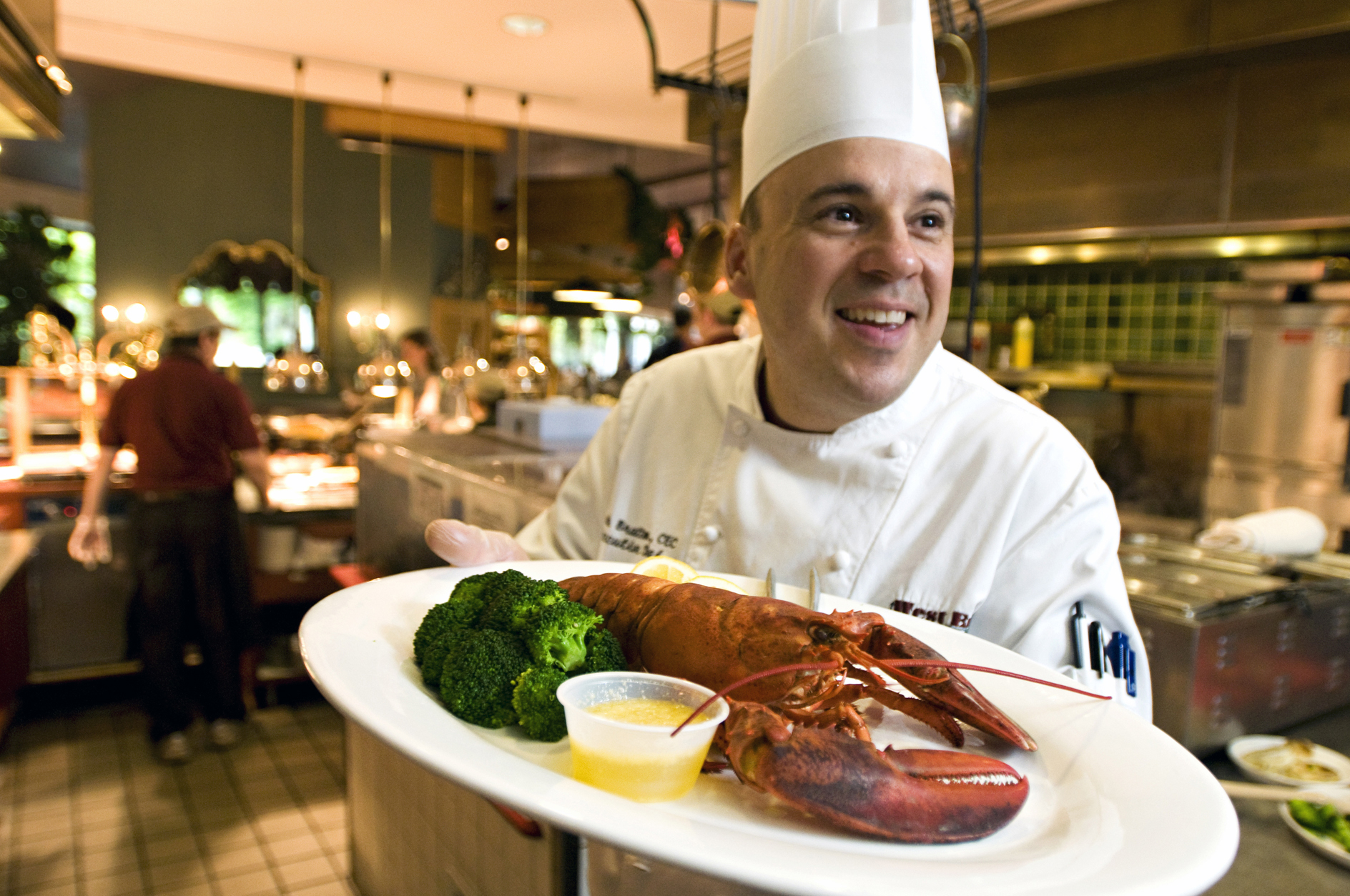 Executive Chef Mark Bratton serves lobster at West End Market