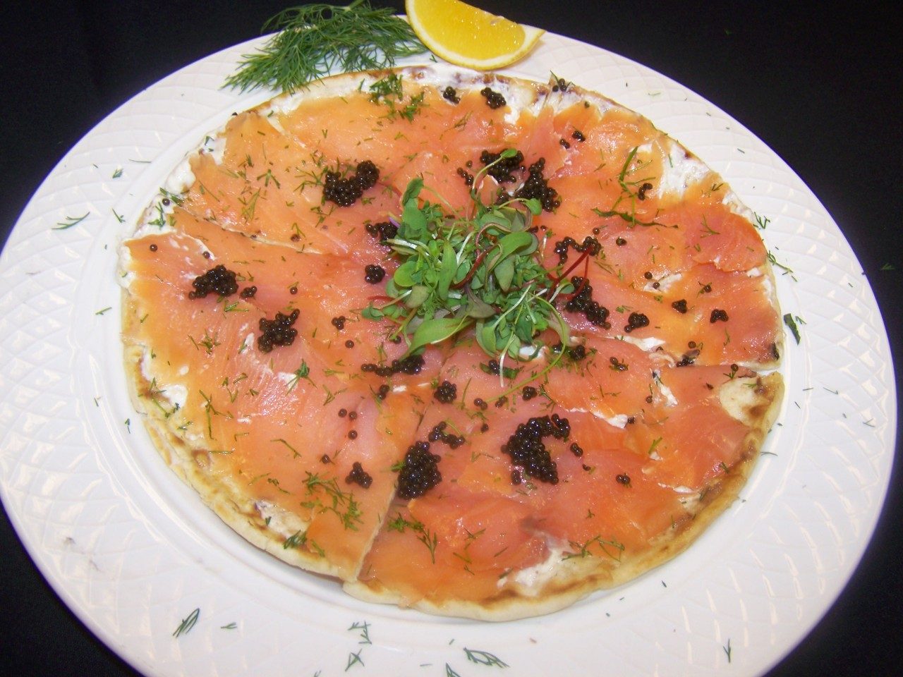 Preston’s smoked salmon flatbread features fresh dill from the garden. 