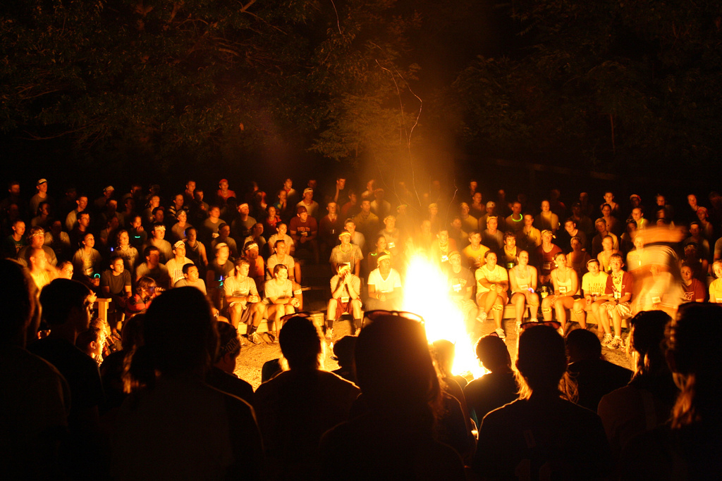 Students gather around a bonfire at Hokie Camp.