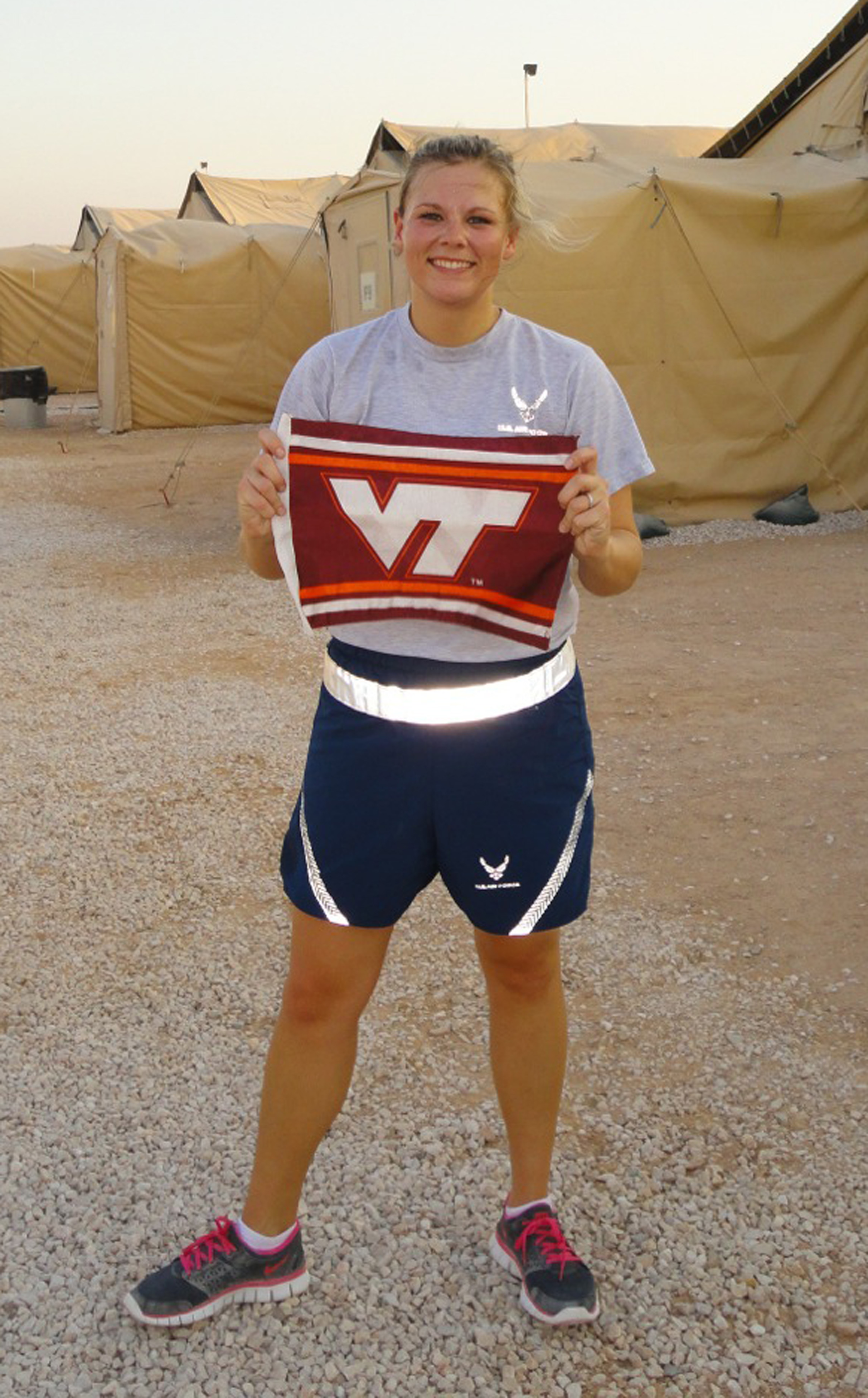 2nd Lt. Tavia Carlson, U.S. Air Force, Virginia Tech Corps of Cadets Class of 2009 shown from her deployed location last April 16 after running a personal 3.2-Mile Run in Remembrance as a show of support to her fellow Hokies.