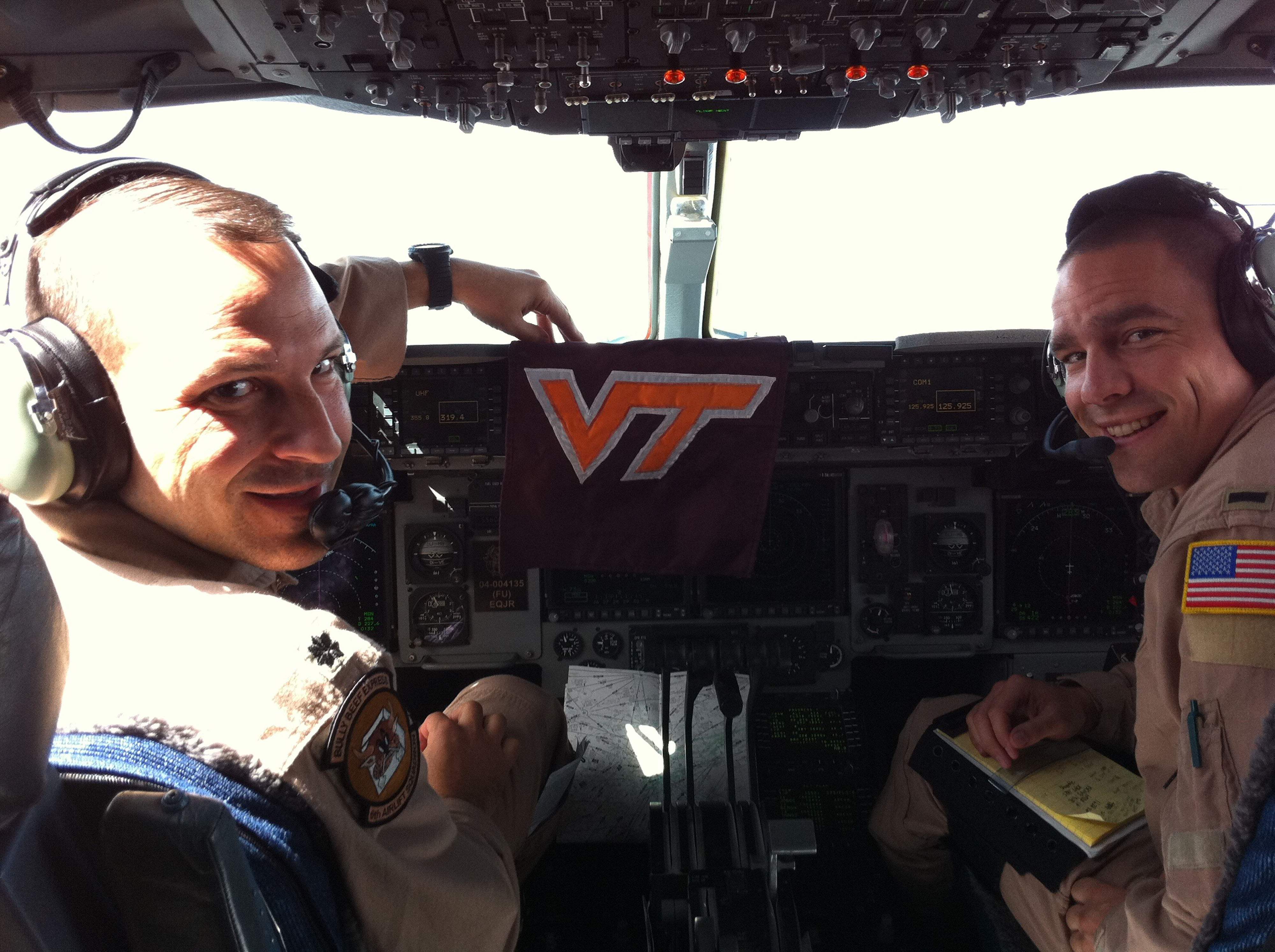 Lt. Col. Doug Hall (left), U.S. Air Force, Virginia Tech Corps of Cadets Class of 1992 and 1st. Lt. Purvis "PC" Gaddis (right), U.S. Air Force, Virginia Tech Corps of Cadets Class of 2009 shown in early September returning from Europe, flying the C-17A Globemaster III that they will bring to Virginia Tech for the Arkansas State game
