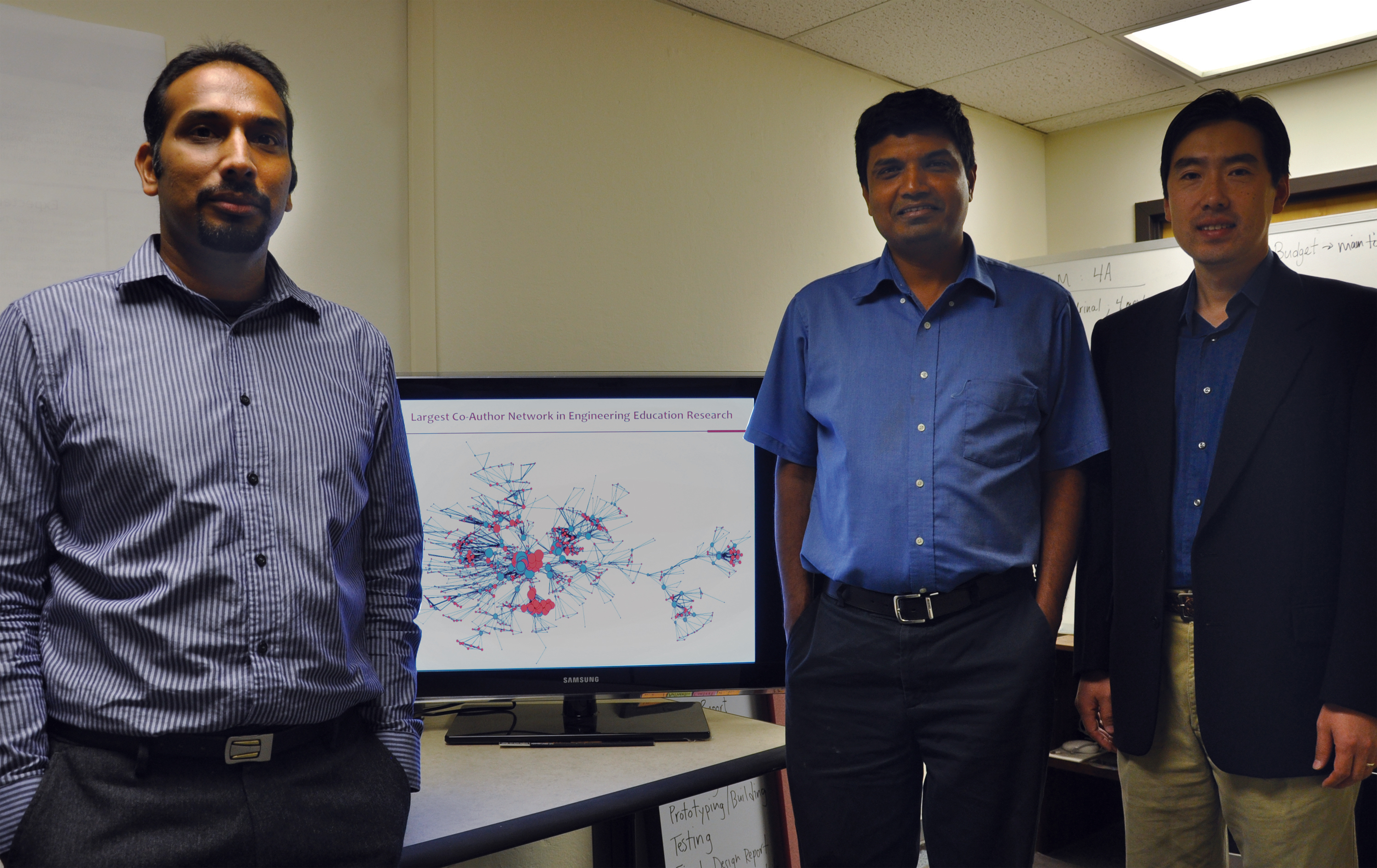 Three researchers at the Discovery Analytics Center 