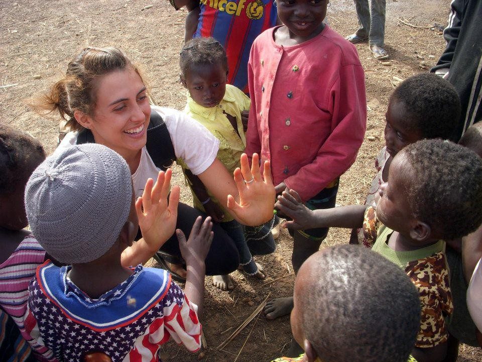 Virginia Tech student Caitlin Mitchell works with children during her study abroad experience in Ghana.