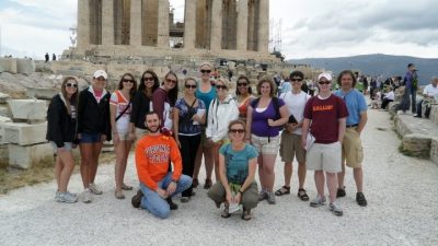 Virginia Tech students pose before Greek antiquities