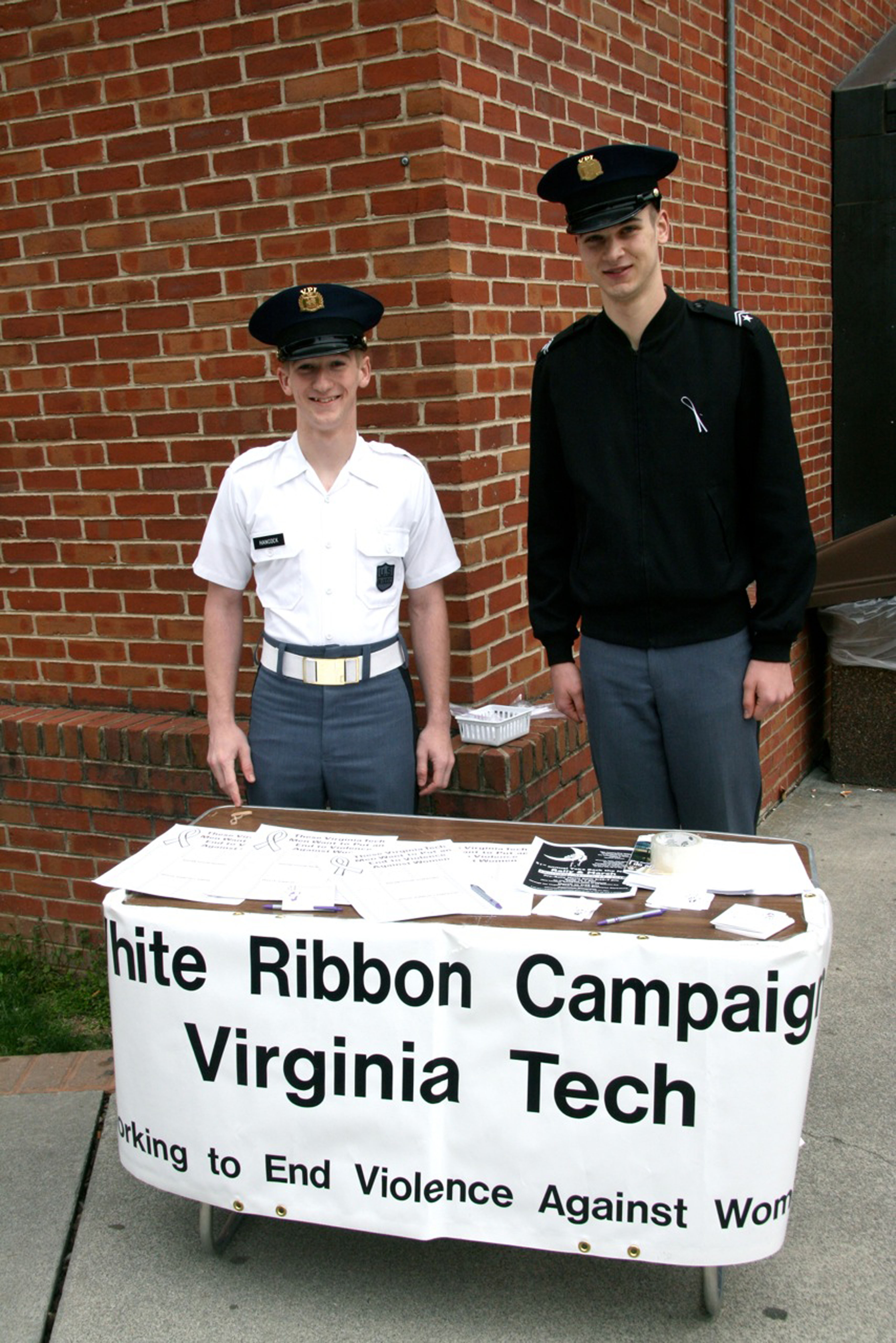 Members of Echo Company of the Virginia Tech Corps of Cadets man a table outside Squires Student Center during the White Ribbon Campaign last year.