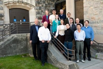 Members of the Virginia Tech Center for Drug Discovery pose in front of Hahn Hall.