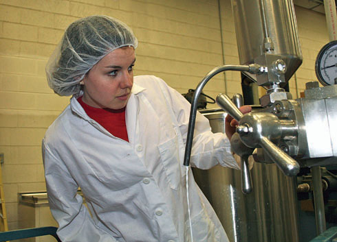 Graduate student in a lab researches milk composition