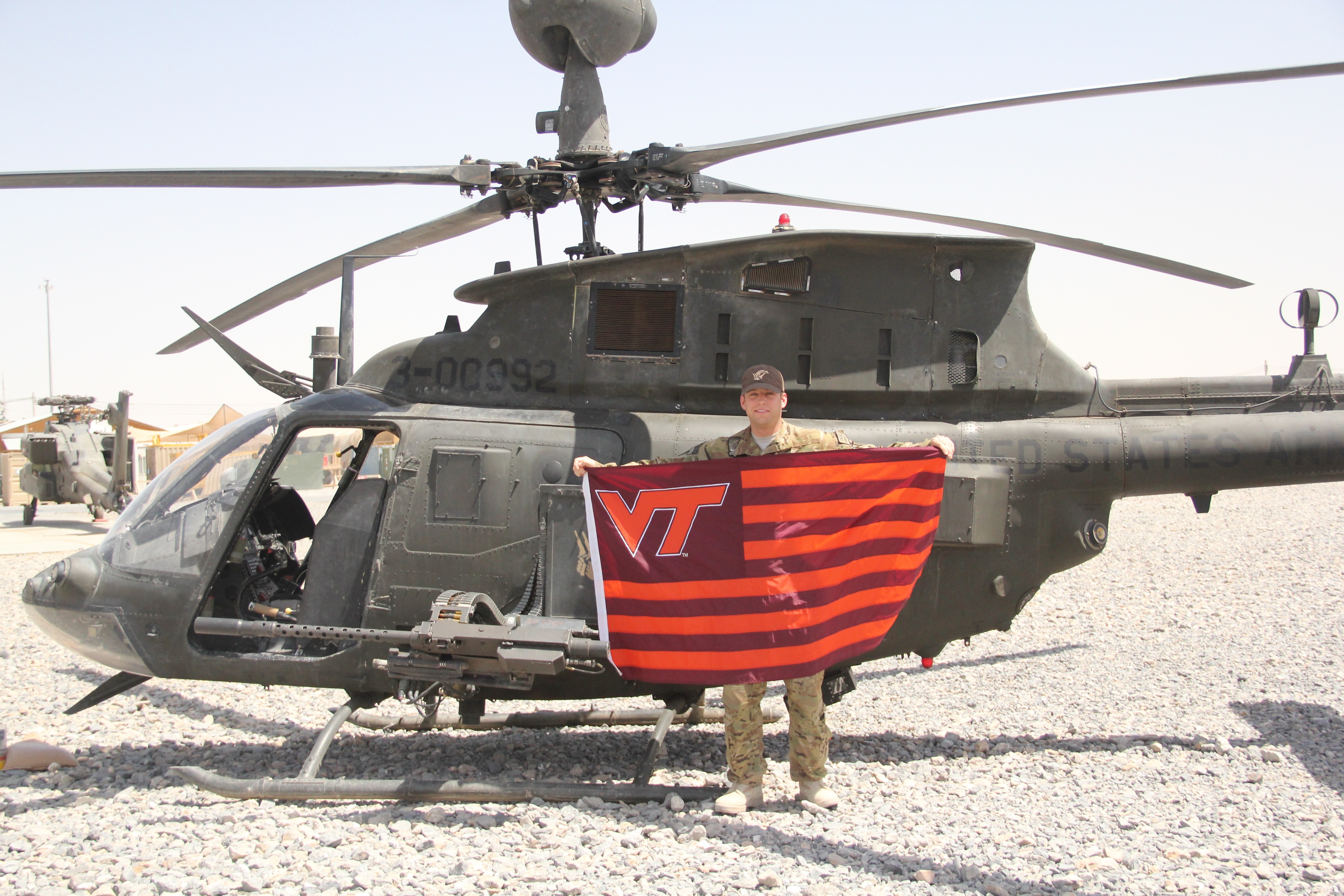 Capt. Andy Howell, U.S. Army, Virginia Tech Corps of Cadets Class of 2007 shown with his helicopter in Afghanistan