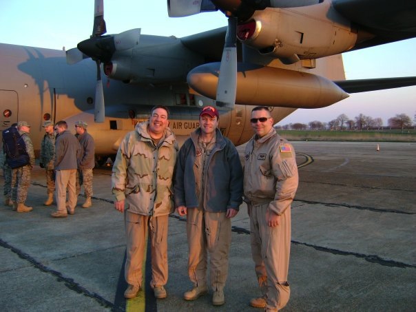  Lt. Col. Phil Millett, Kentucky Air National Guard, Virginia Tech Corps of Cadets Class of 1988 (center) shown with fellow crew members in front of their C-130 in route to Afghanistan.