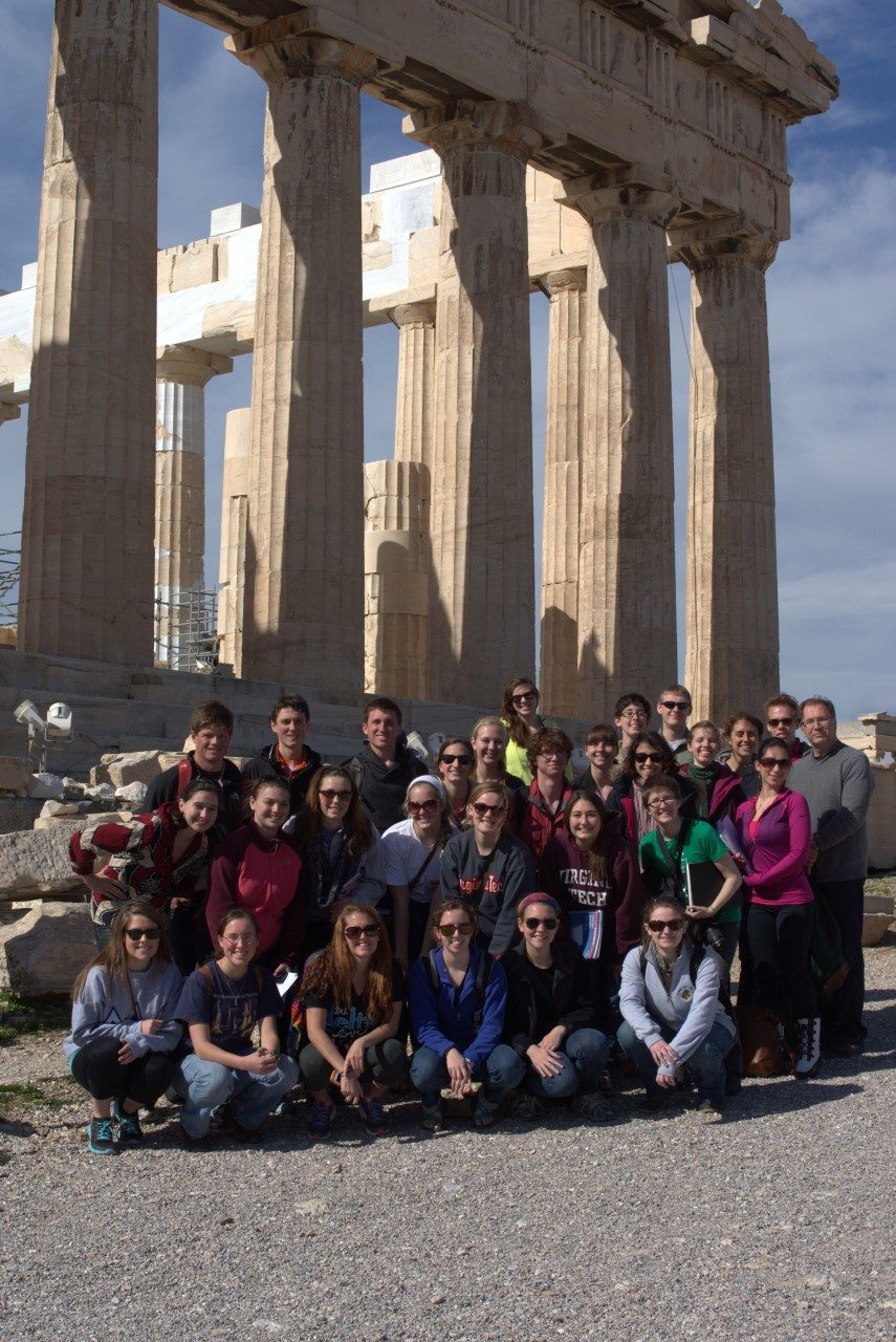 The 28 student participants and Director of University Honors Terry Papillon pose at the Parthenon in Athens, Greece.