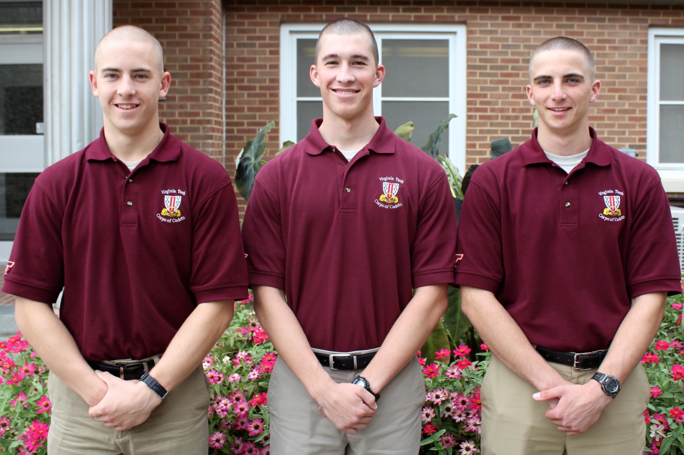 From left to right are Cadets Andrew Bergman, Richard Daum, and Andrew Greenwood standing in front of Brodie Hall.