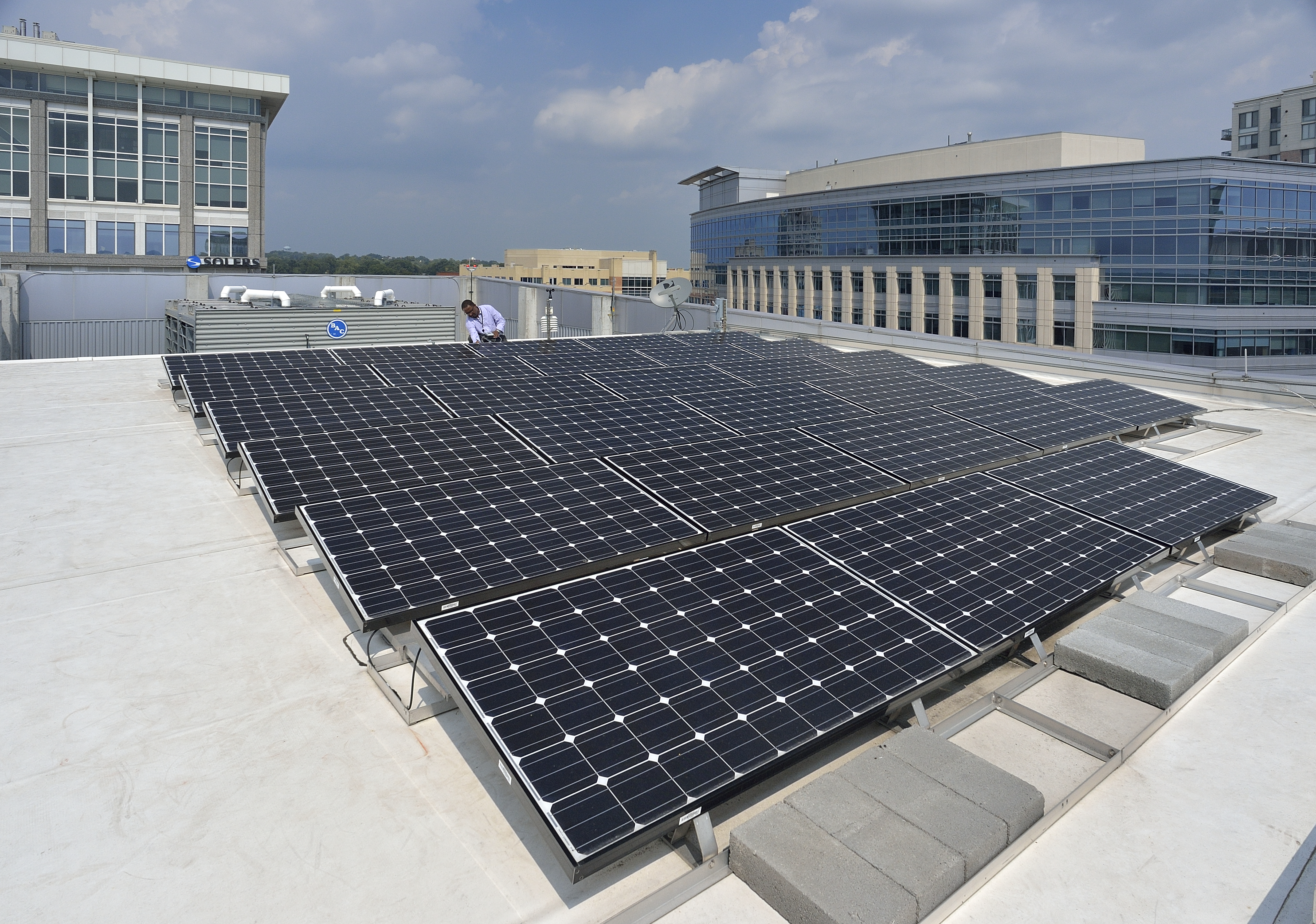A solar photovoltaic system is installed on the roof of the Virginia Tech Research Center -- Arlington.