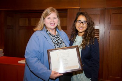 Vice President for Student Affairs Patty Perillo presents Anusha Rizvi with an Aspire! Award. 