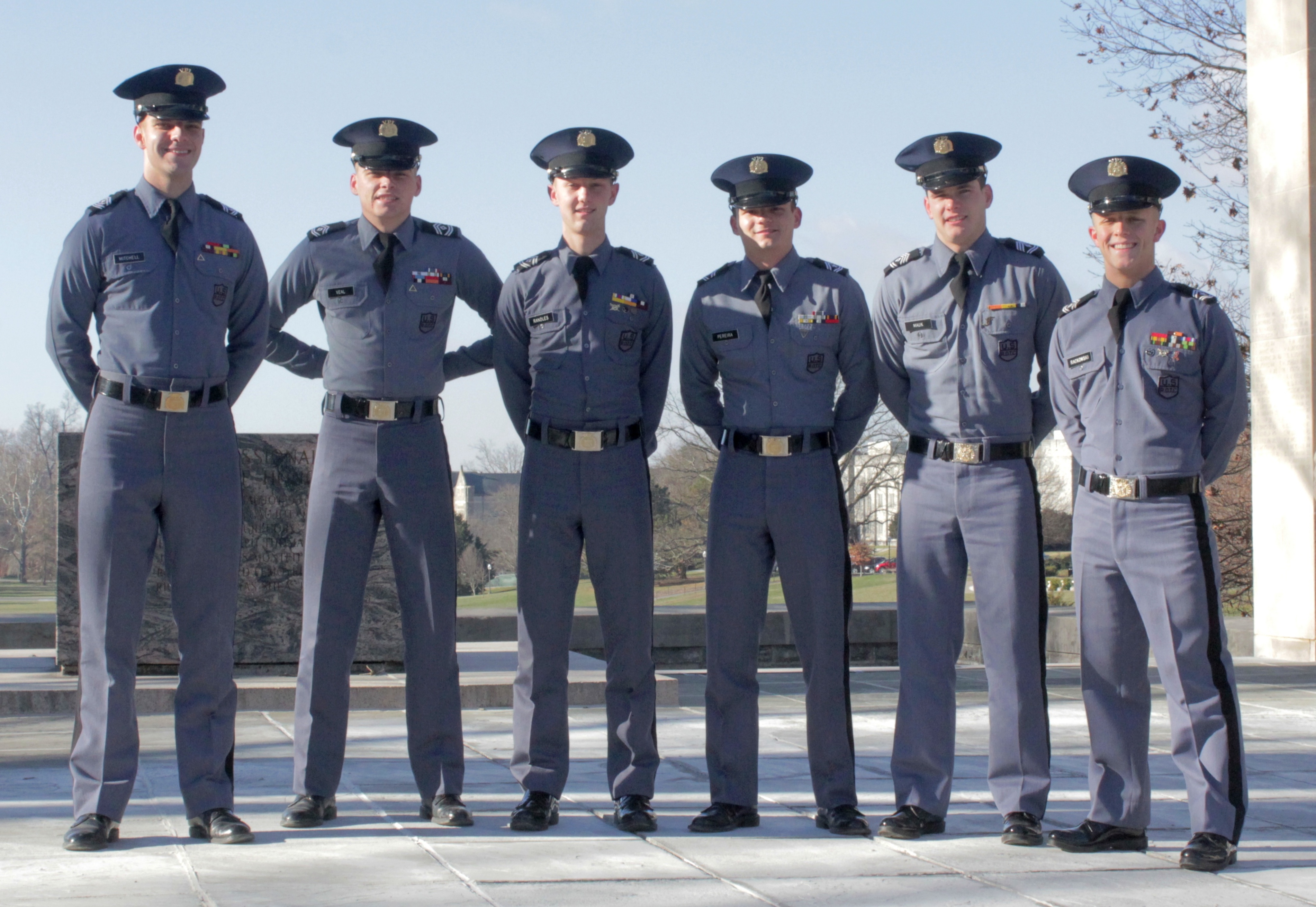 From left to right are members of the Virginia Tech Corps of Cadets Color Guard Cadets Cory Mitchell, Cameron Veal, Tyler Randles, Raymond Pereira, Logan Mauk, and Tim Rackowski standing in front of the Pylons.