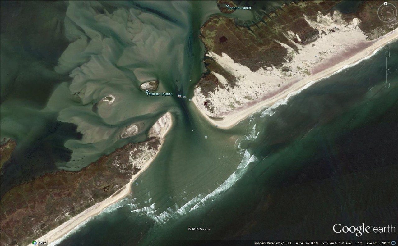 This aerial view shows the new inlet on New York’s Fire Island and large areas of sand pushed over vegetation by Hurricane Sandy. Image generated from Google Earth.