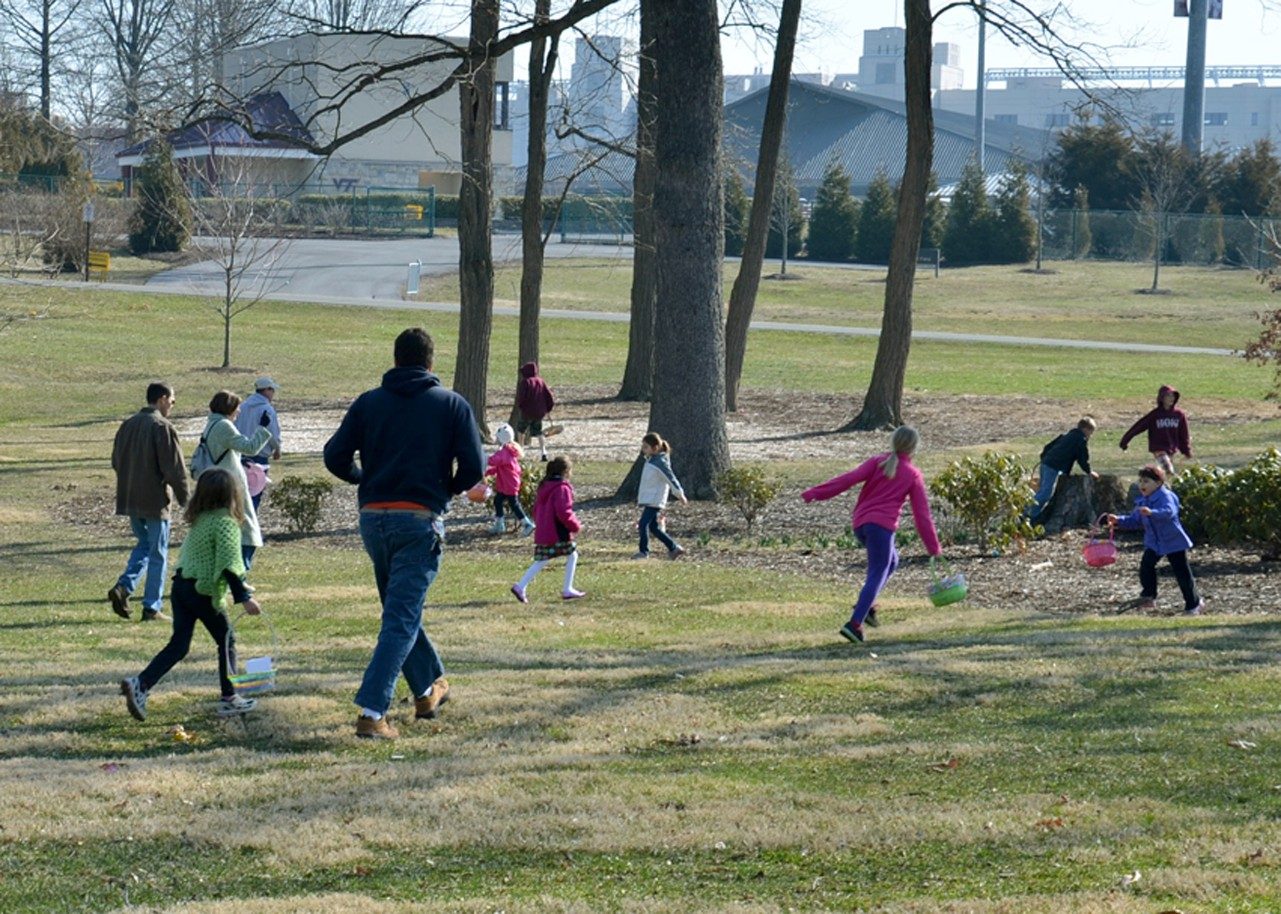 Children search for eggs in the veterinary college's historic oak grove. The annual Easter egg hunt is free and open to the public.