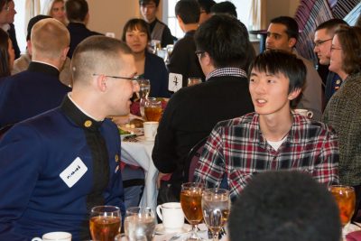A cadet talks with a Language and Culture Institute student