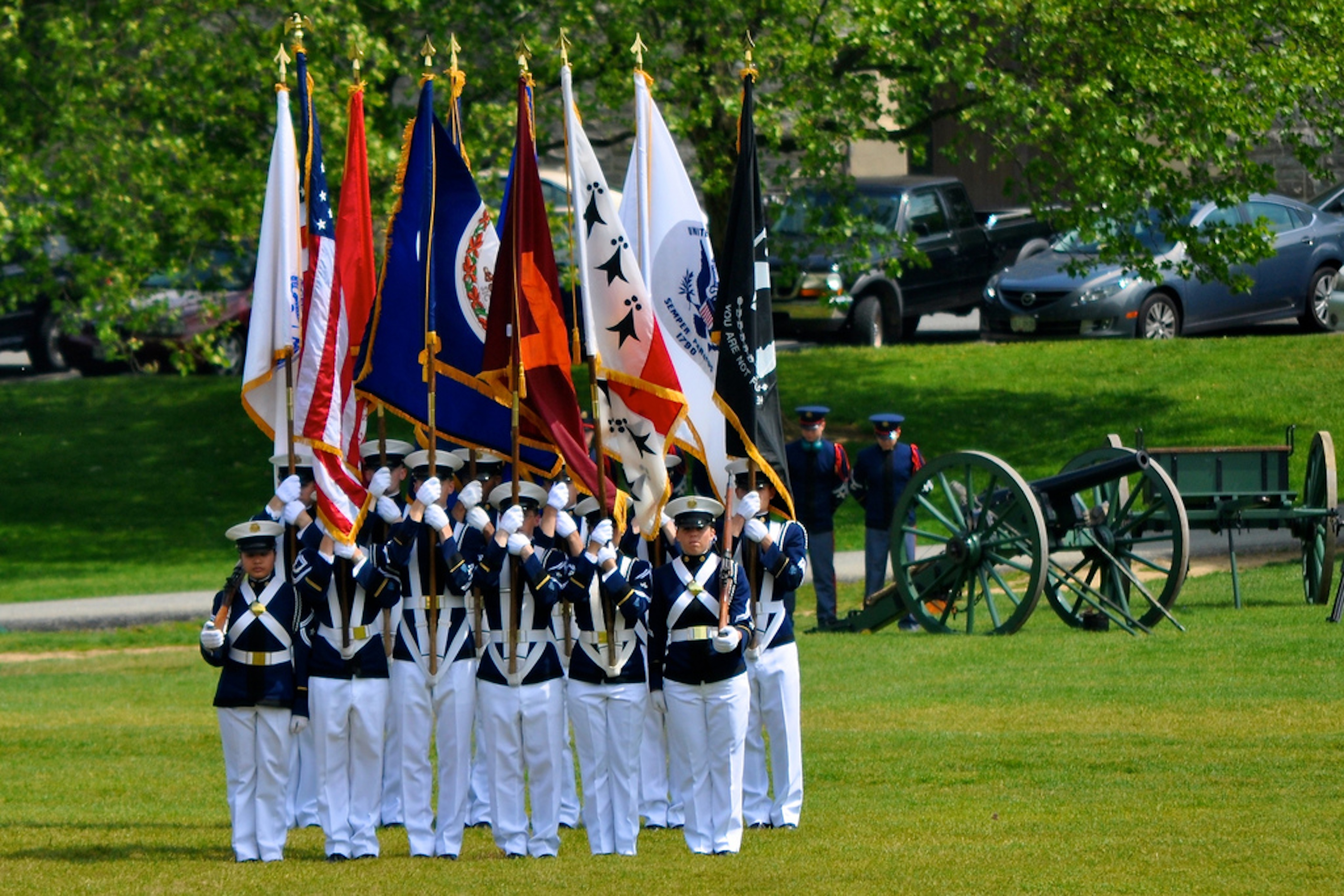 The Virginia Tech Corps of Cadets Color Guard and cannon, Skipper, prepare for the start of a parade on the Drillfield.
