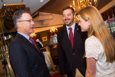 Timothy Sands talks with Brent Ashley, outgoing SGA president, and Elizabeth Lazor, incoming SGA president.