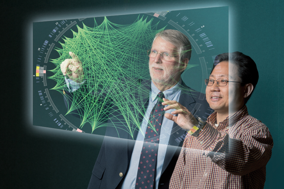 A blended image showing Pamplin faculty members Terry Rakes (left) and Patrick Fan with a computer generated visualization of data related to genome mapping. The Center for Business Intelligence and Analytics seeks to be an interdisciplinary resource in the growing field of big data.