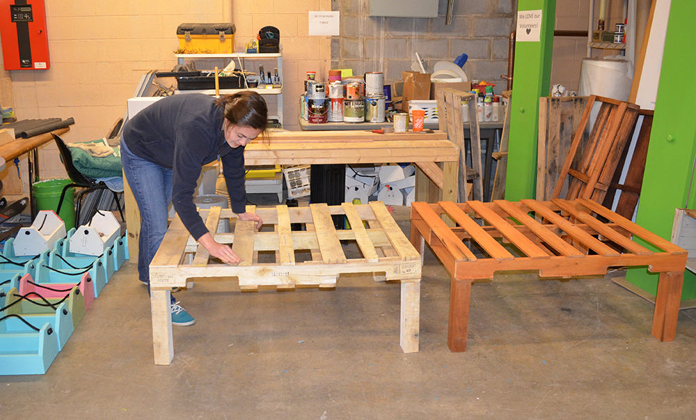 Cassidy Kees helps build furniture and repurpose donations at the Habitat for Humanity ReStore in Christiansburg, Virginia