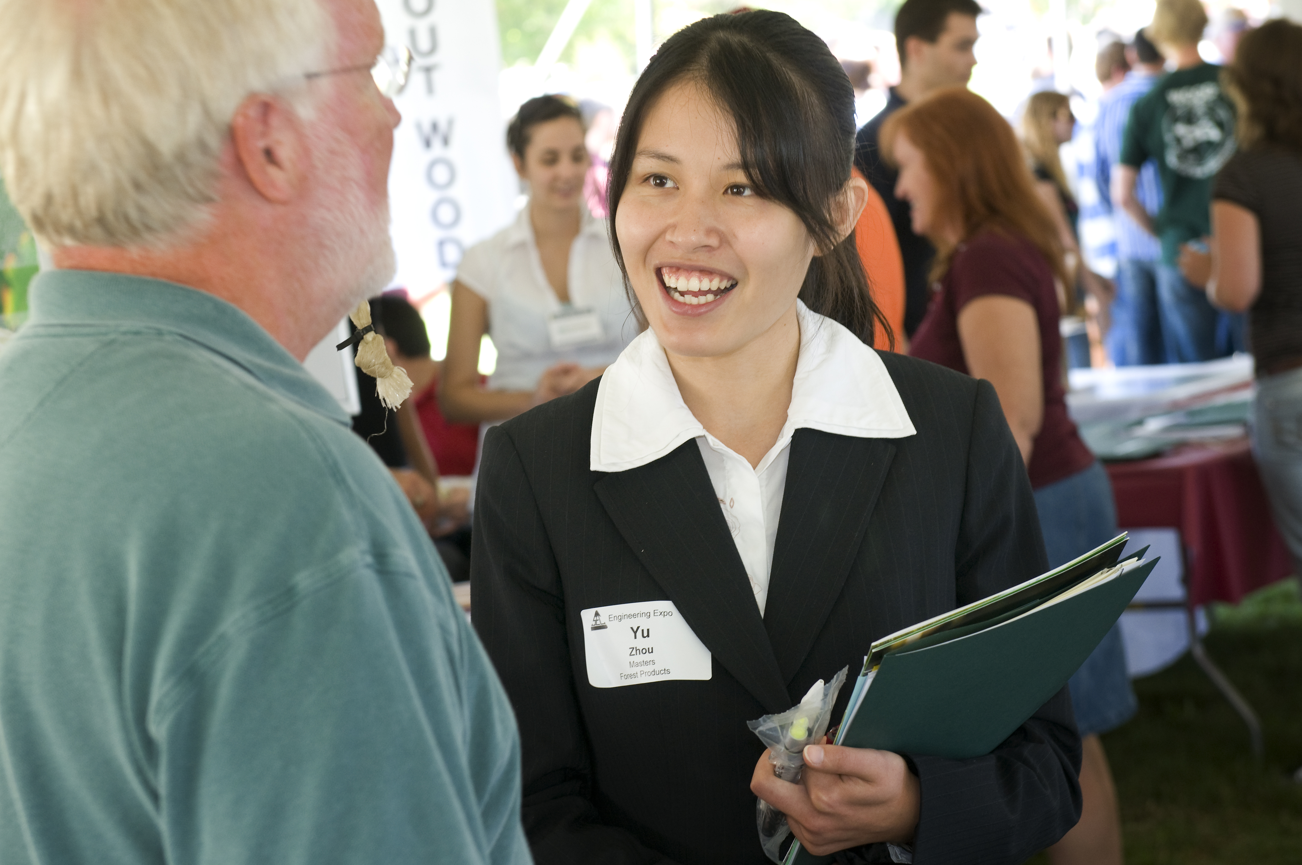 Student talks to a recruiter at a job fair