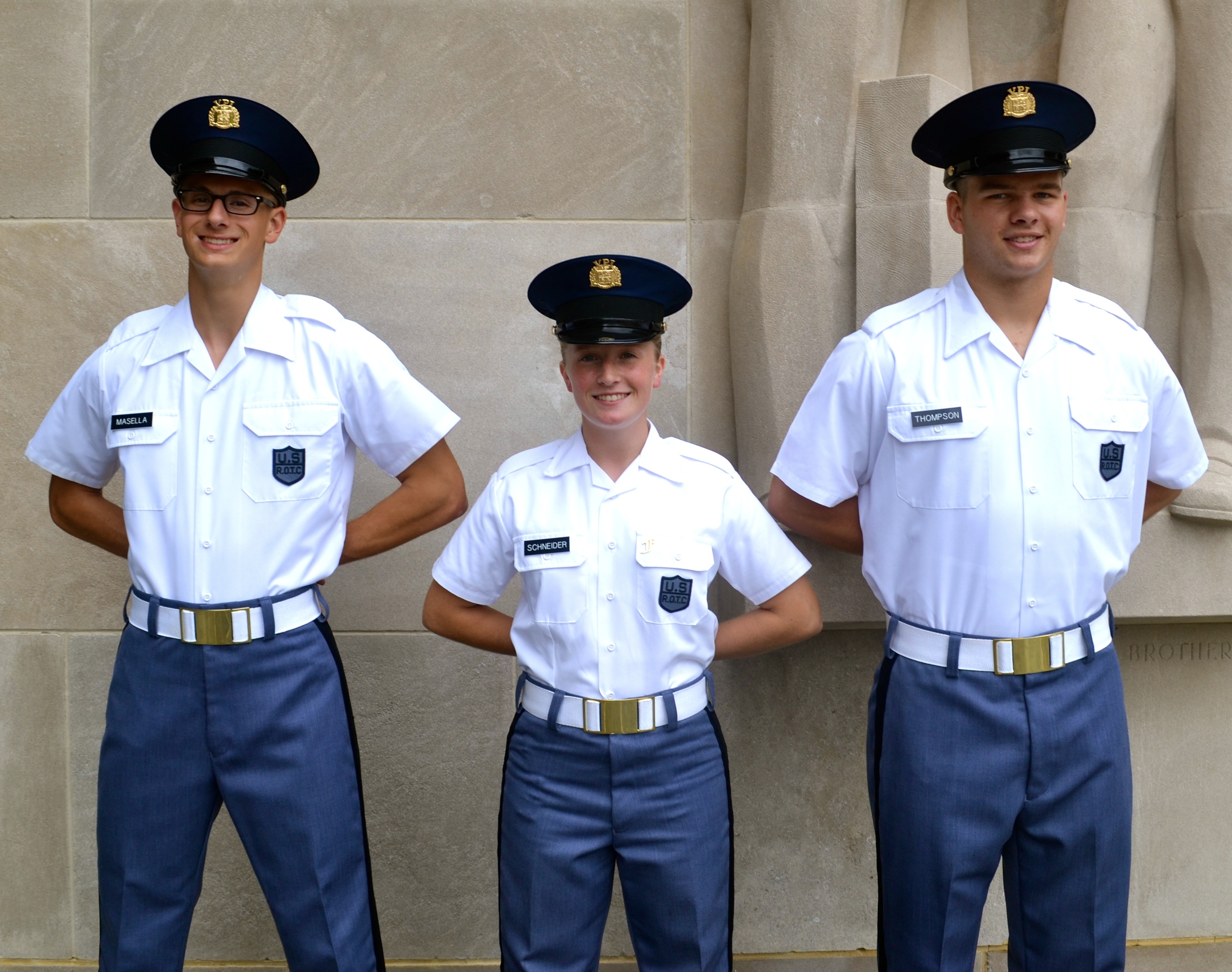 Standing in front of the Pylongs from left to right are Cadets Nicholas Masella, Robyn Schneider, and Matthew Thompson.