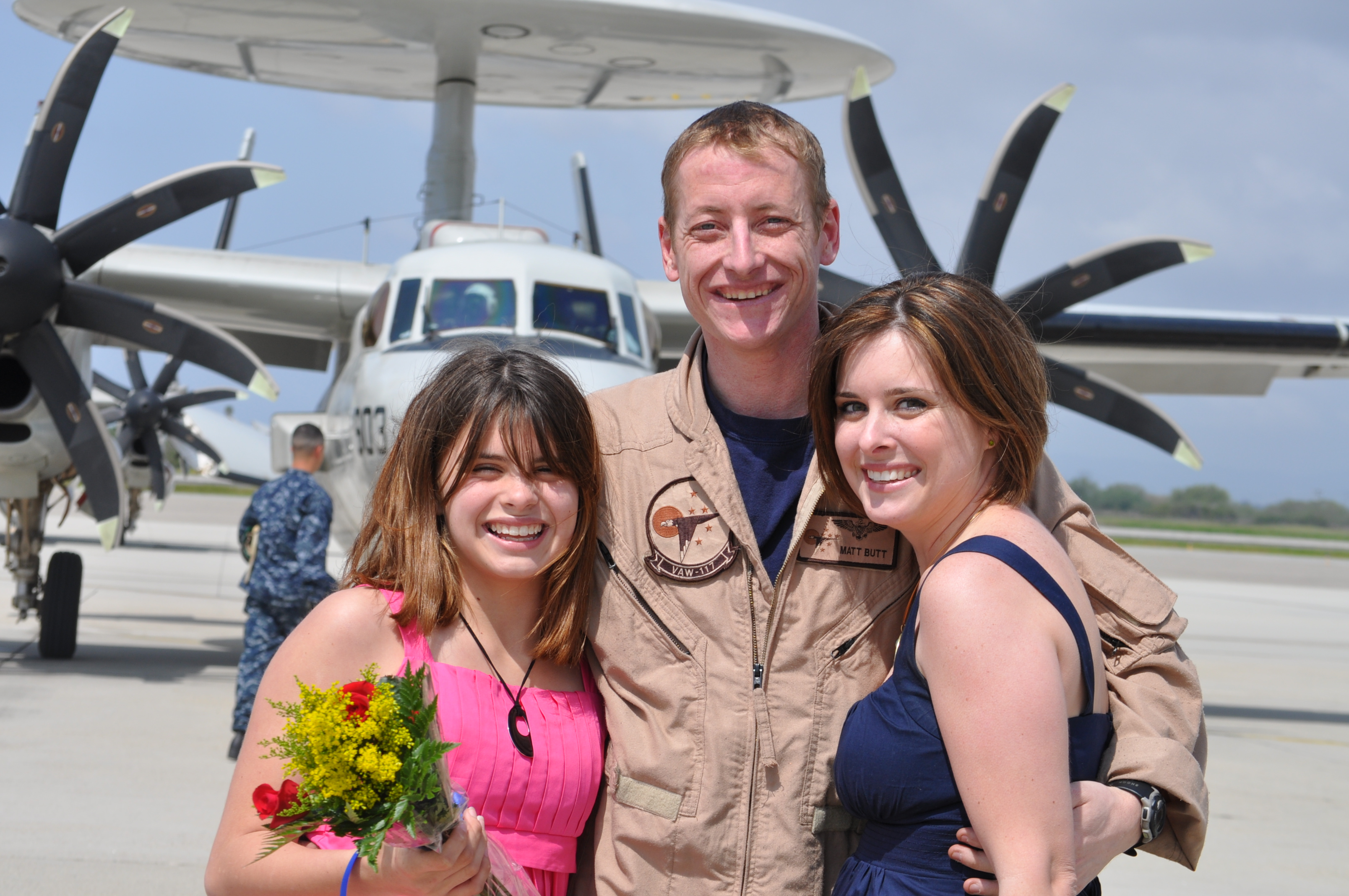 Lt. Cmdr. Matthew Butt, U.S. Navy, Virginia Tech Corps of Cadets Class of 2003, center, with his family.