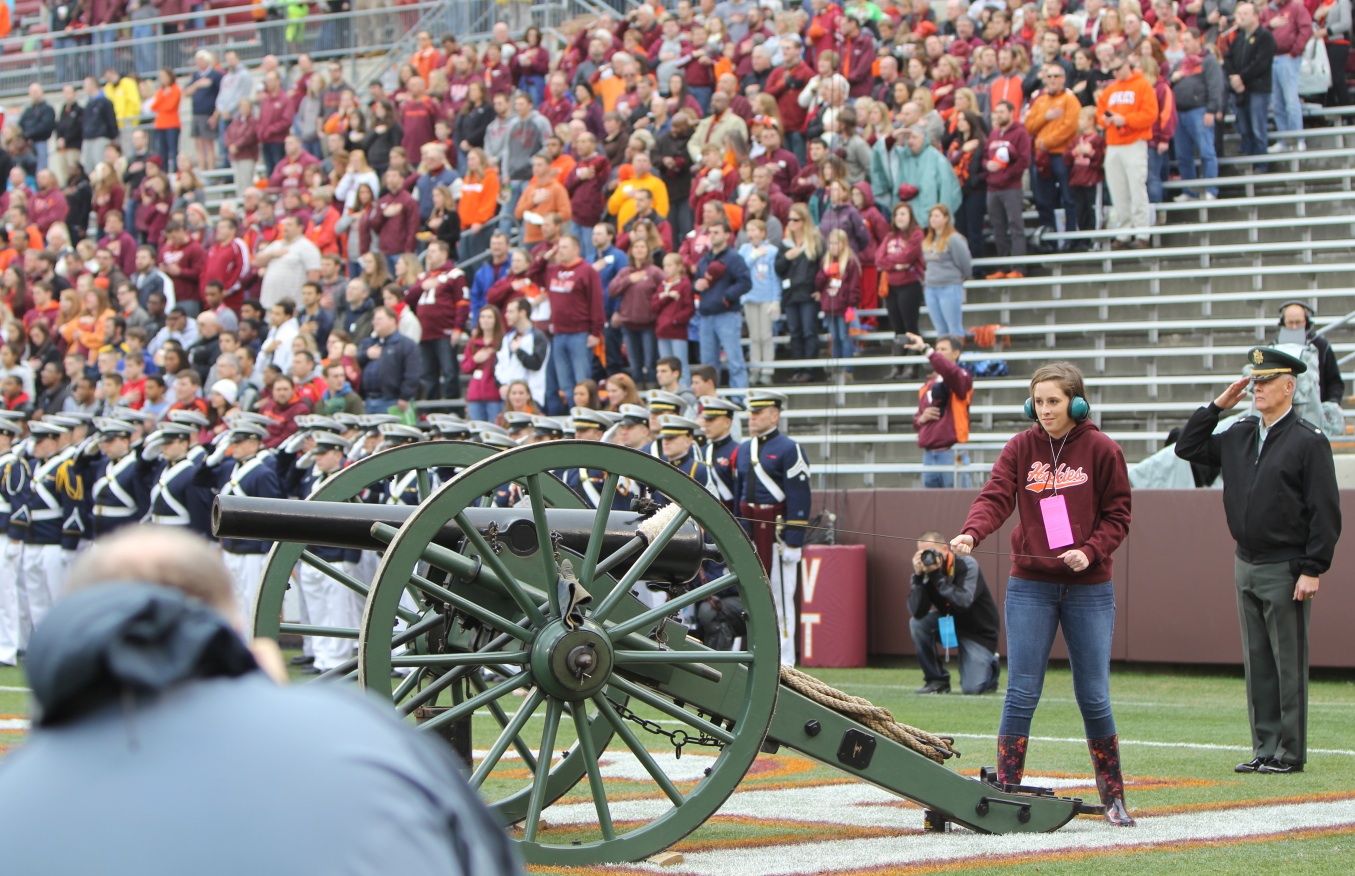 The Wounded Warrior Project raffle winner prepares to fire Skipper prior to the 2013 Virginia Tech versus Maryland football game.