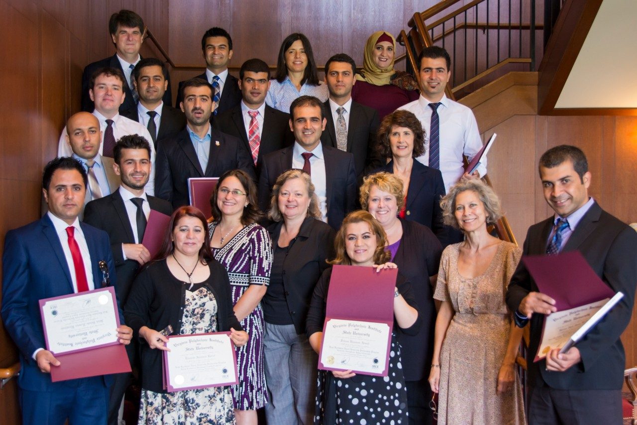Participants in the Iraqi Kurdistan Rural Universities Partnership Program pose on graduation day with professors and administrators from the Language and Culture Institute.
